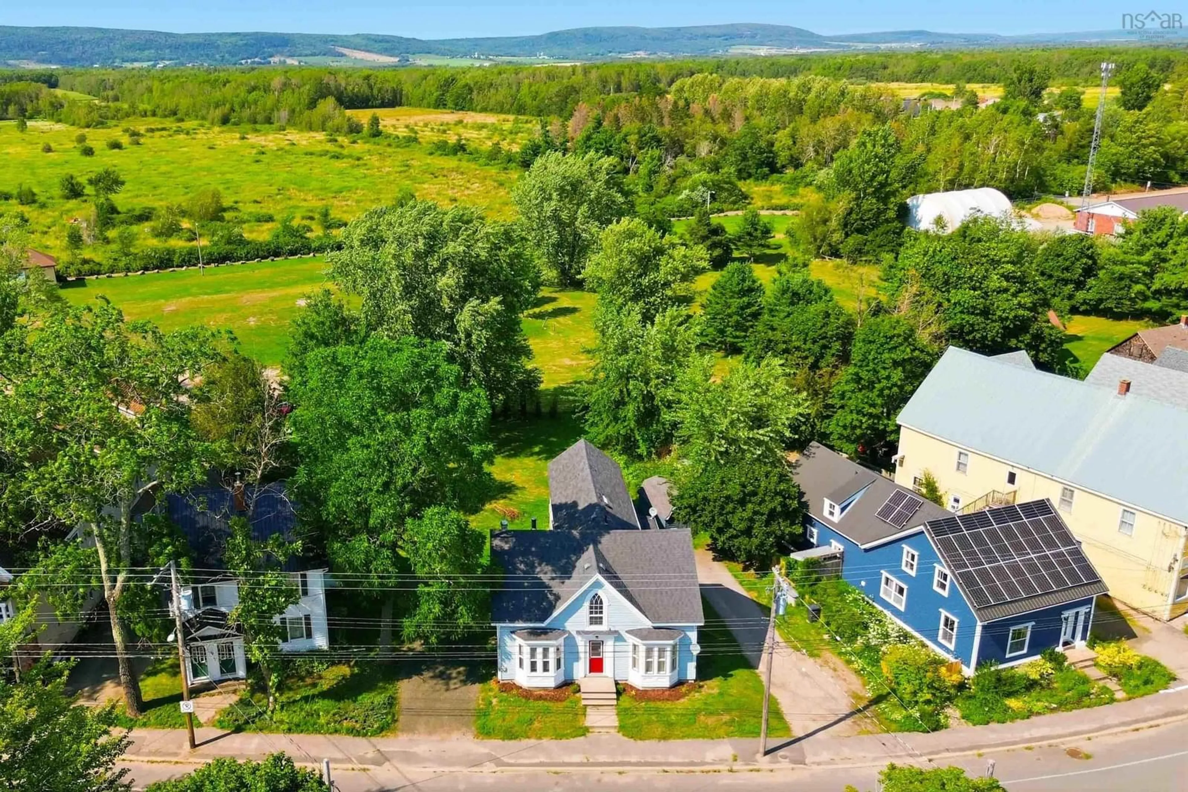 A pic from outside/outdoor area/front of a property/back of a property/a pic from drone, unknown for 525 Main St, Lawrencetown Nova Scotia B0S 1M0