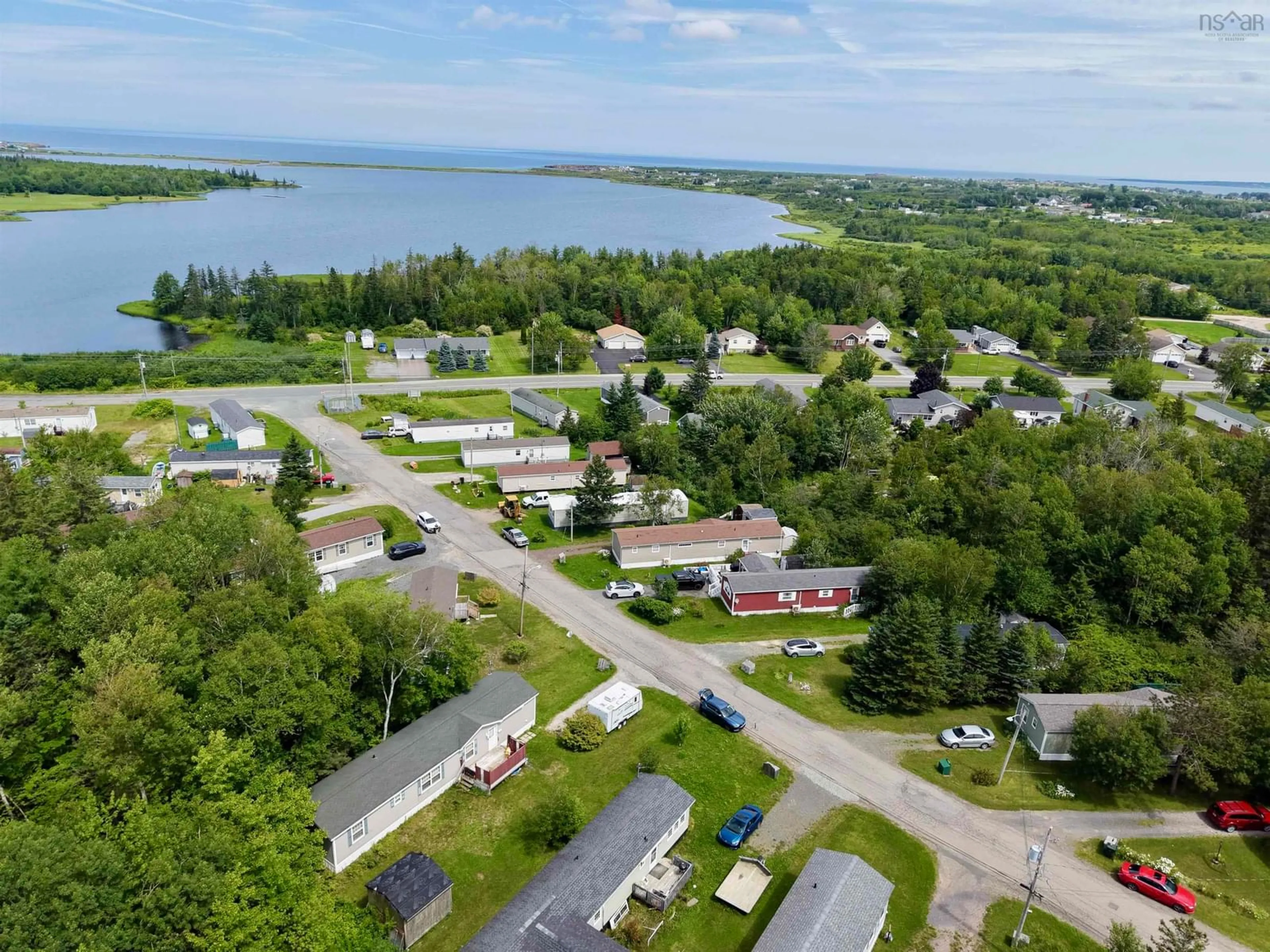 A pic from outside/outdoor area/front of a property/back of a property/a pic from drone, water/lake/river/ocean view for 28 Bendix St, Cape Breton Nova Scotia B1V 3C3