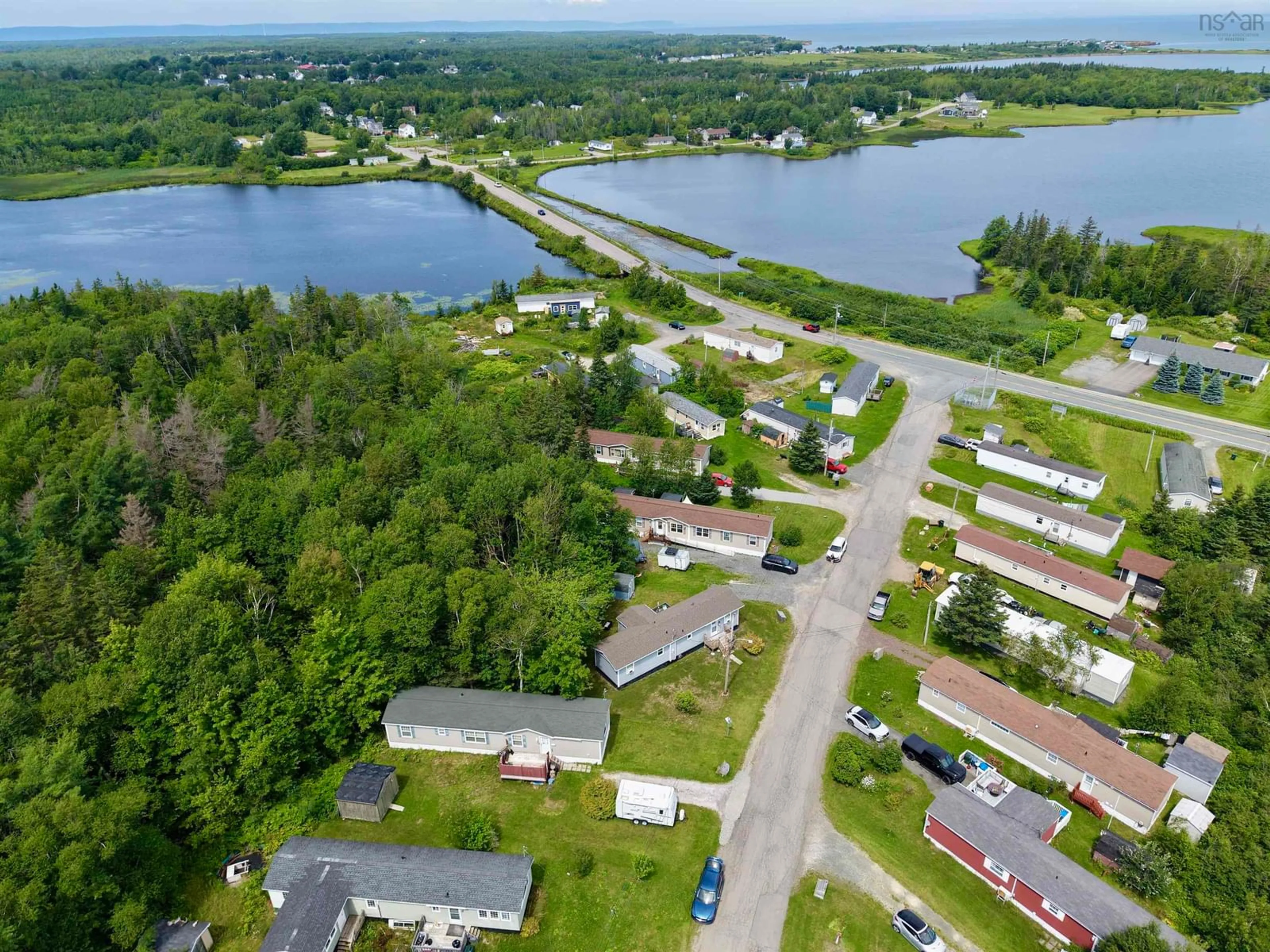 A pic from outside/outdoor area/front of a property/back of a property/a pic from drone, water/lake/river/ocean view for 28 Bendix St, Cape Breton Nova Scotia B1V 3C3