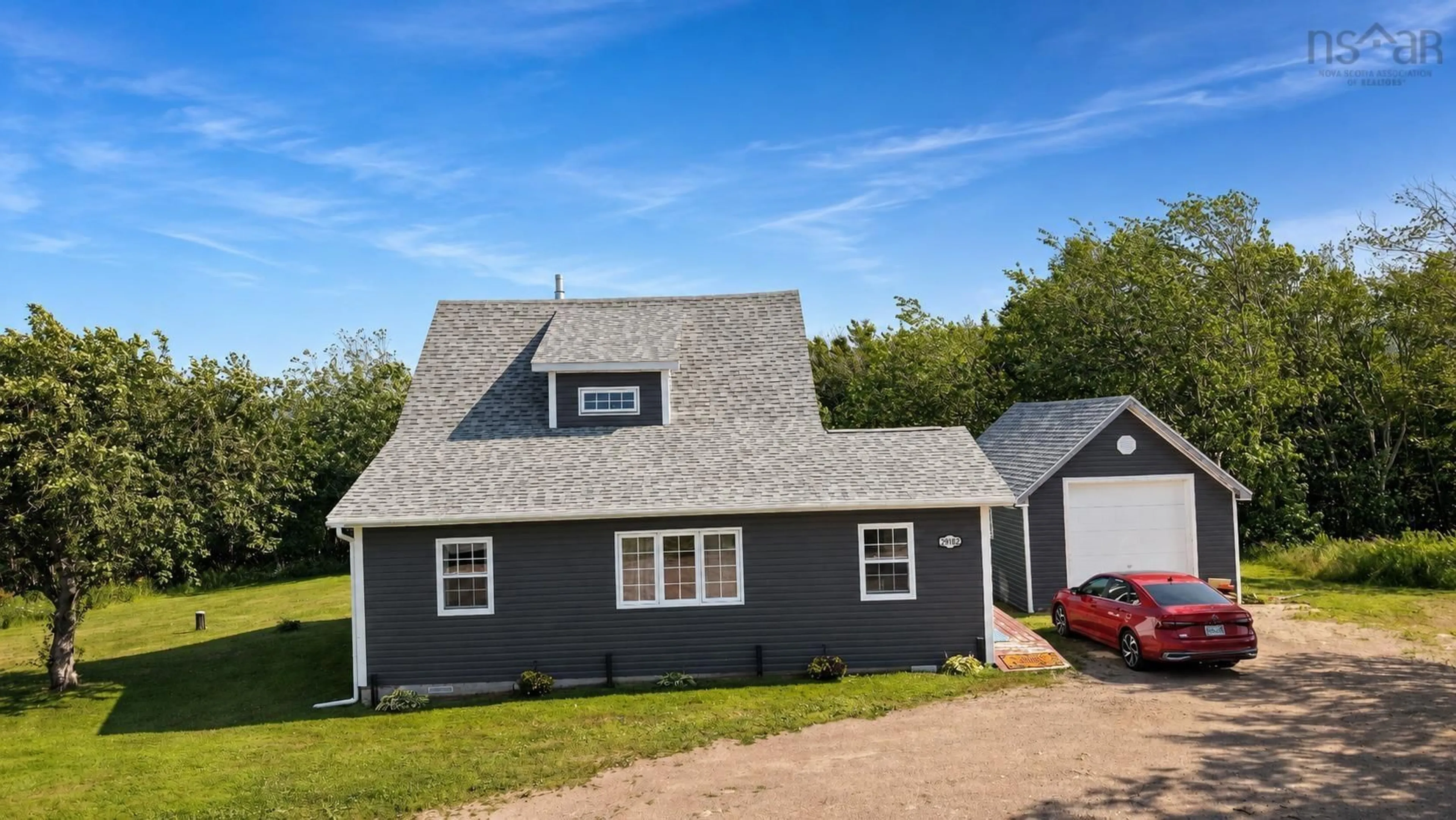 Home with vinyl exterior material, street for 29182 Cabot Trail, Cape North Nova Scotia B0C 1G0