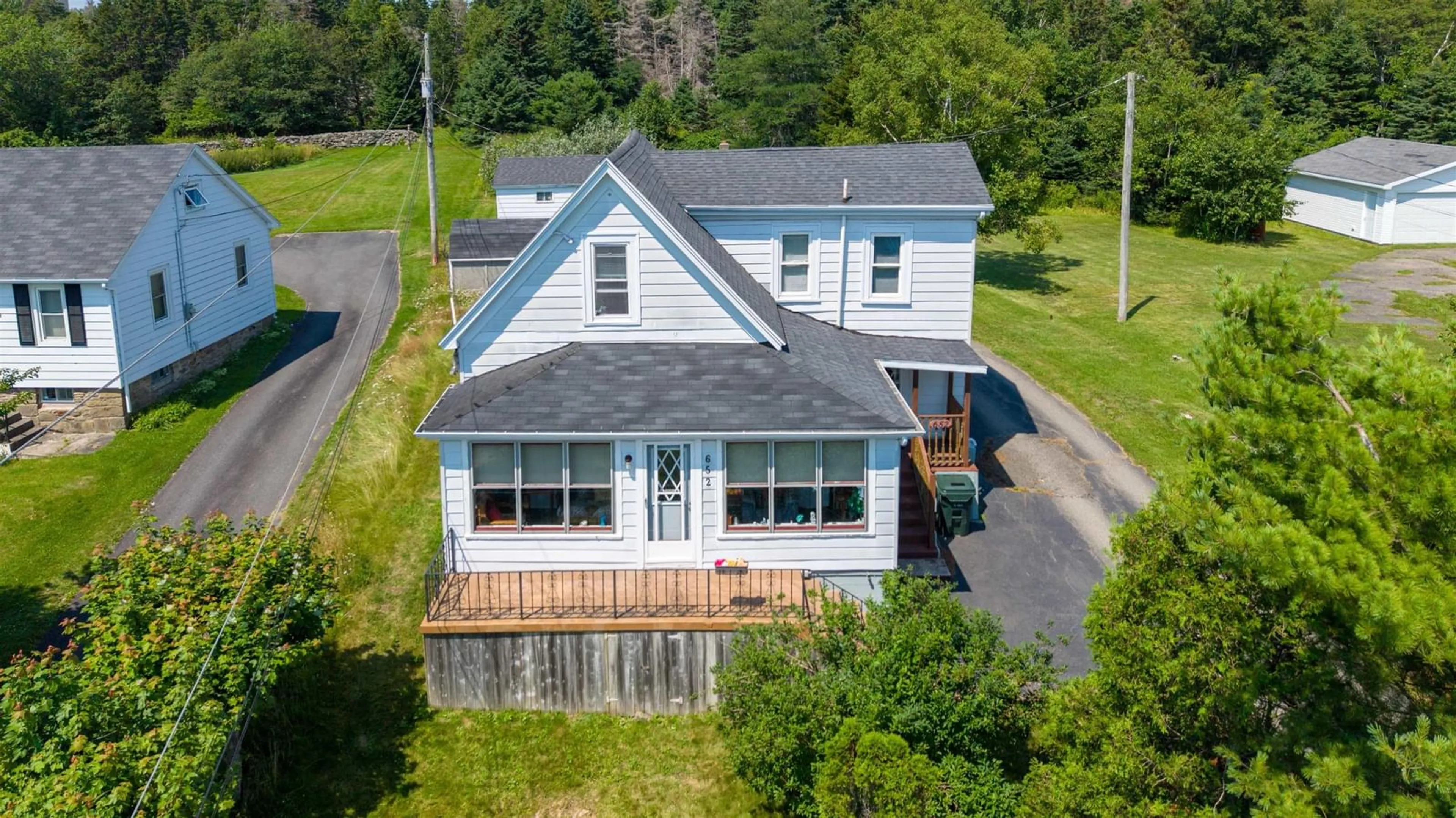 A pic from outside/outdoor area/front of a property/back of a property/a pic from drone, unknown for 652 Shore Rd, Sydney Mines Nova Scotia B1V 1A1