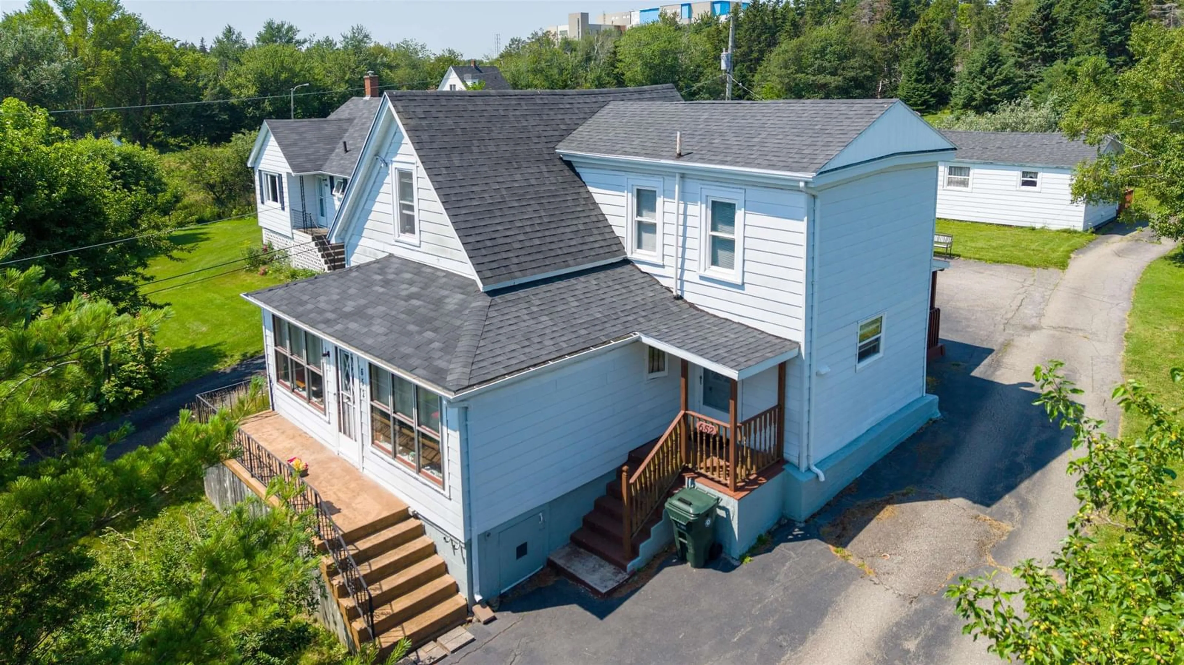 A pic from outside/outdoor area/front of a property/back of a property/a pic from drone, unknown for 652 Shore Rd, Sydney Mines Nova Scotia B1V 1A1