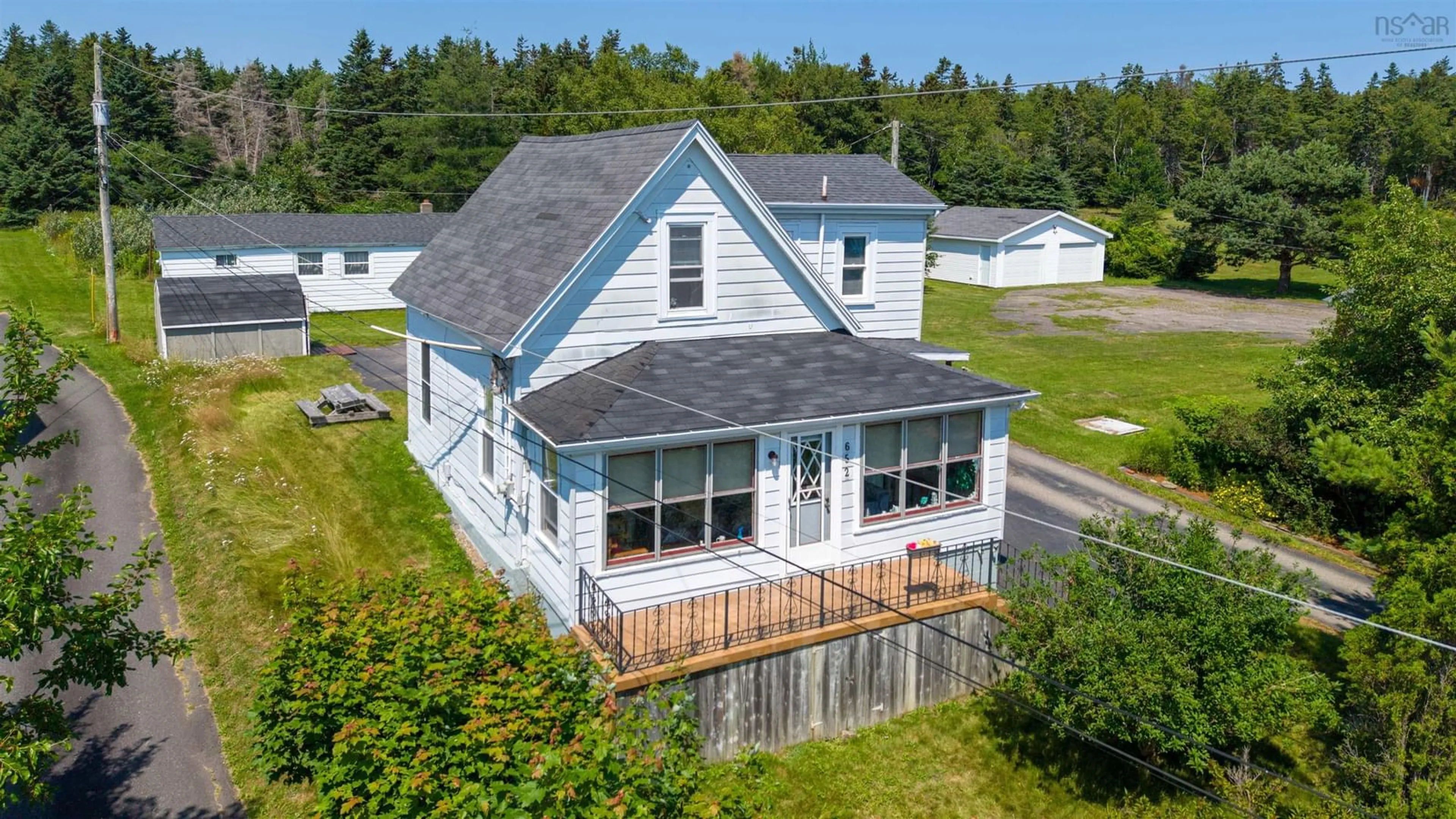 A pic from outside/outdoor area/front of a property/back of a property/a pic from drone, water/lake/river/ocean view for 652 Shore Rd, Sydney Mines Nova Scotia B1V 1A1