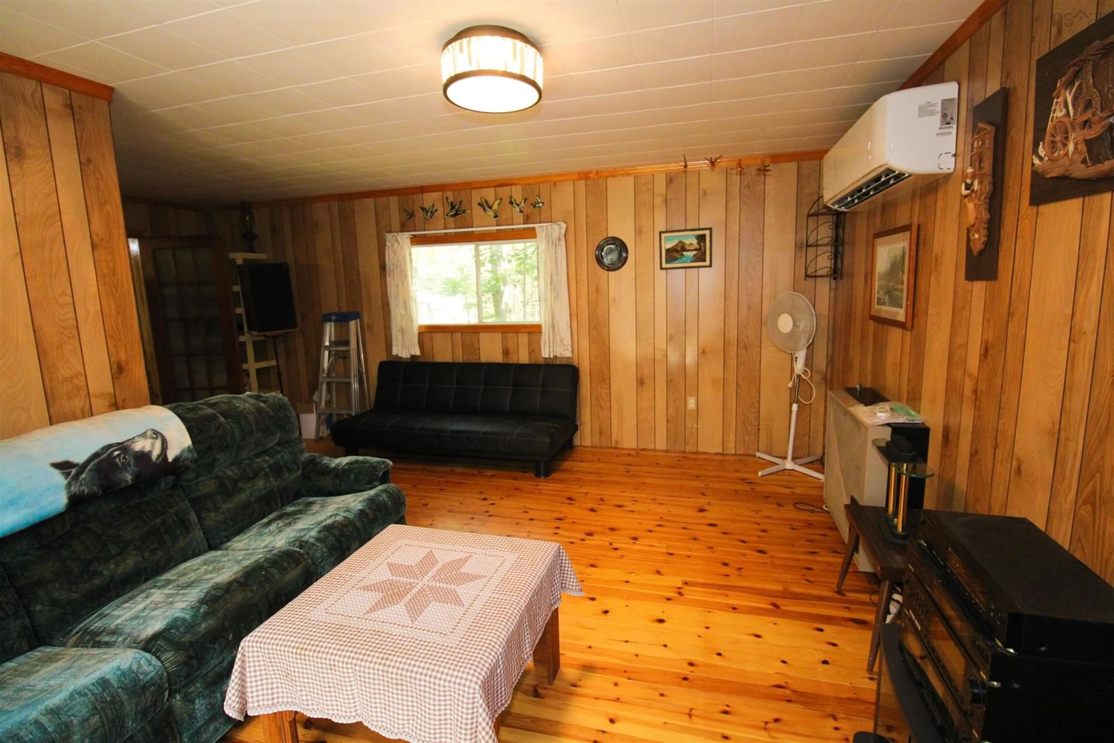 Living room with furniture, wood/laminate floor for 507 Turner Point Dr, Walden Nova Scotia B0J 2E0
