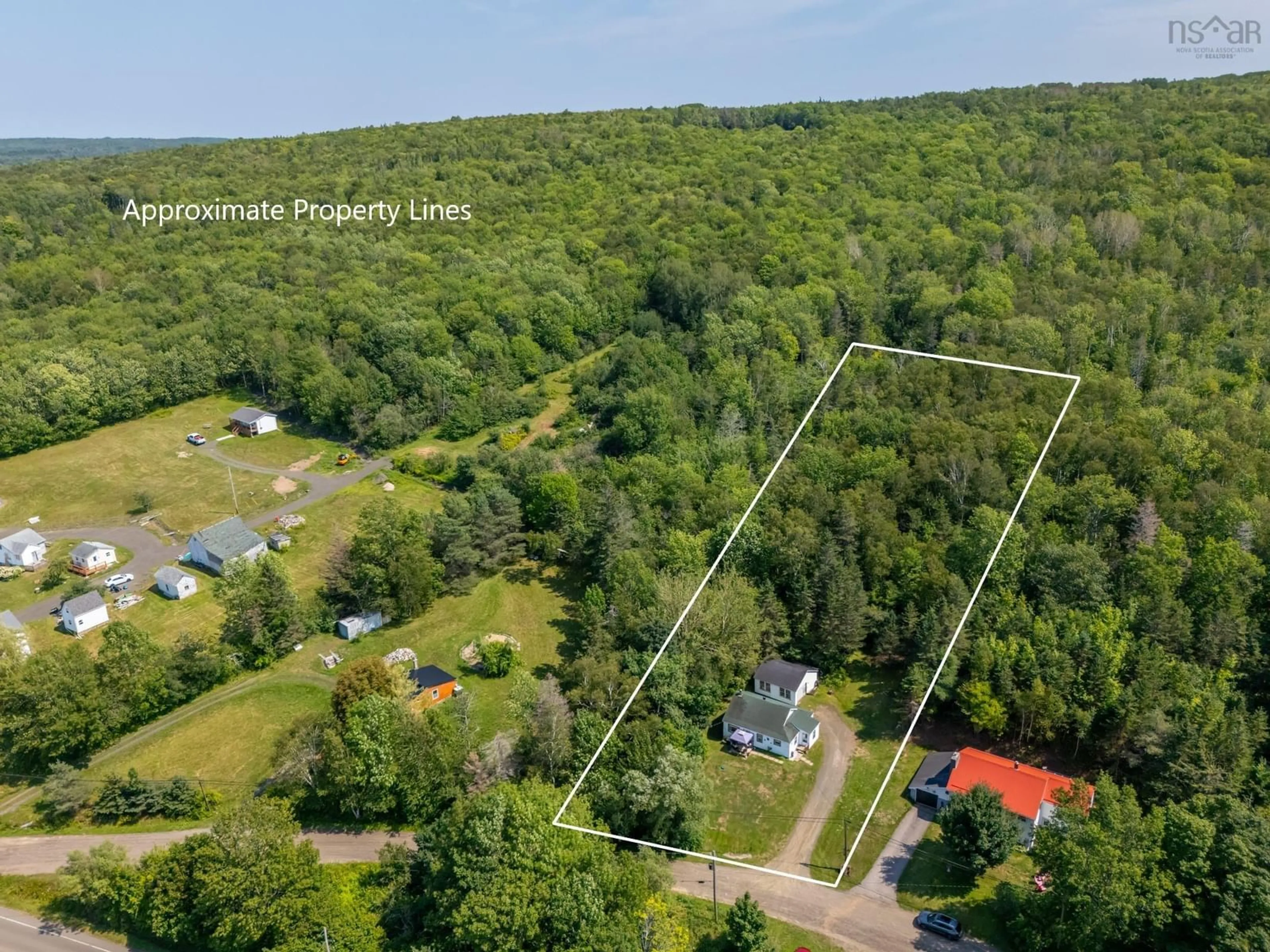 A pic from outside/outdoor area/front of a property/back of a property/a pic from drone, forest/trees view for 20 M And R St, Clementsport Nova Scotia B0S 1E0