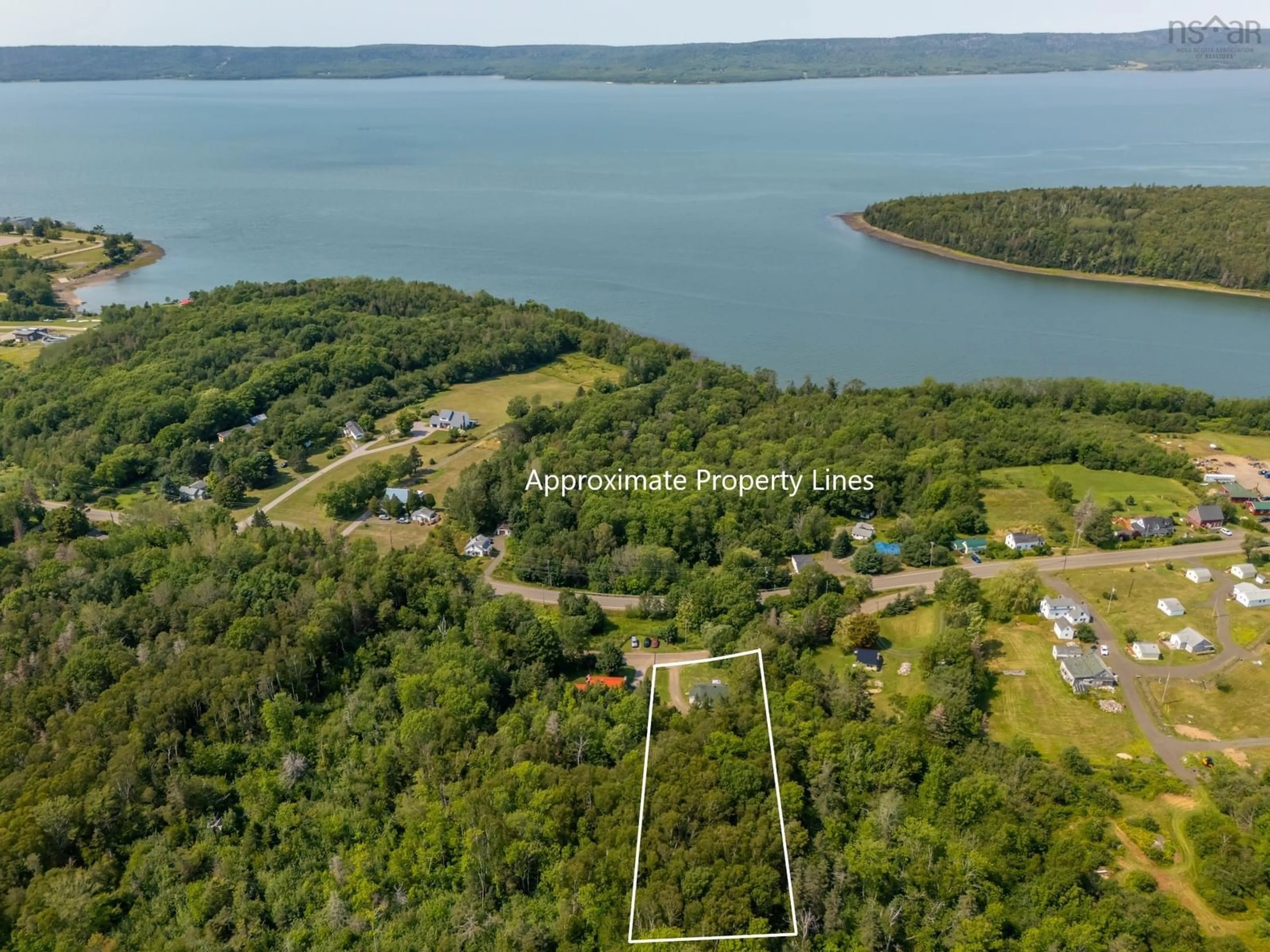 A pic from outside/outdoor area/front of a property/back of a property/a pic from drone, water/lake/river/ocean view for 20 M And R St, Clementsport Nova Scotia B0S 1E0