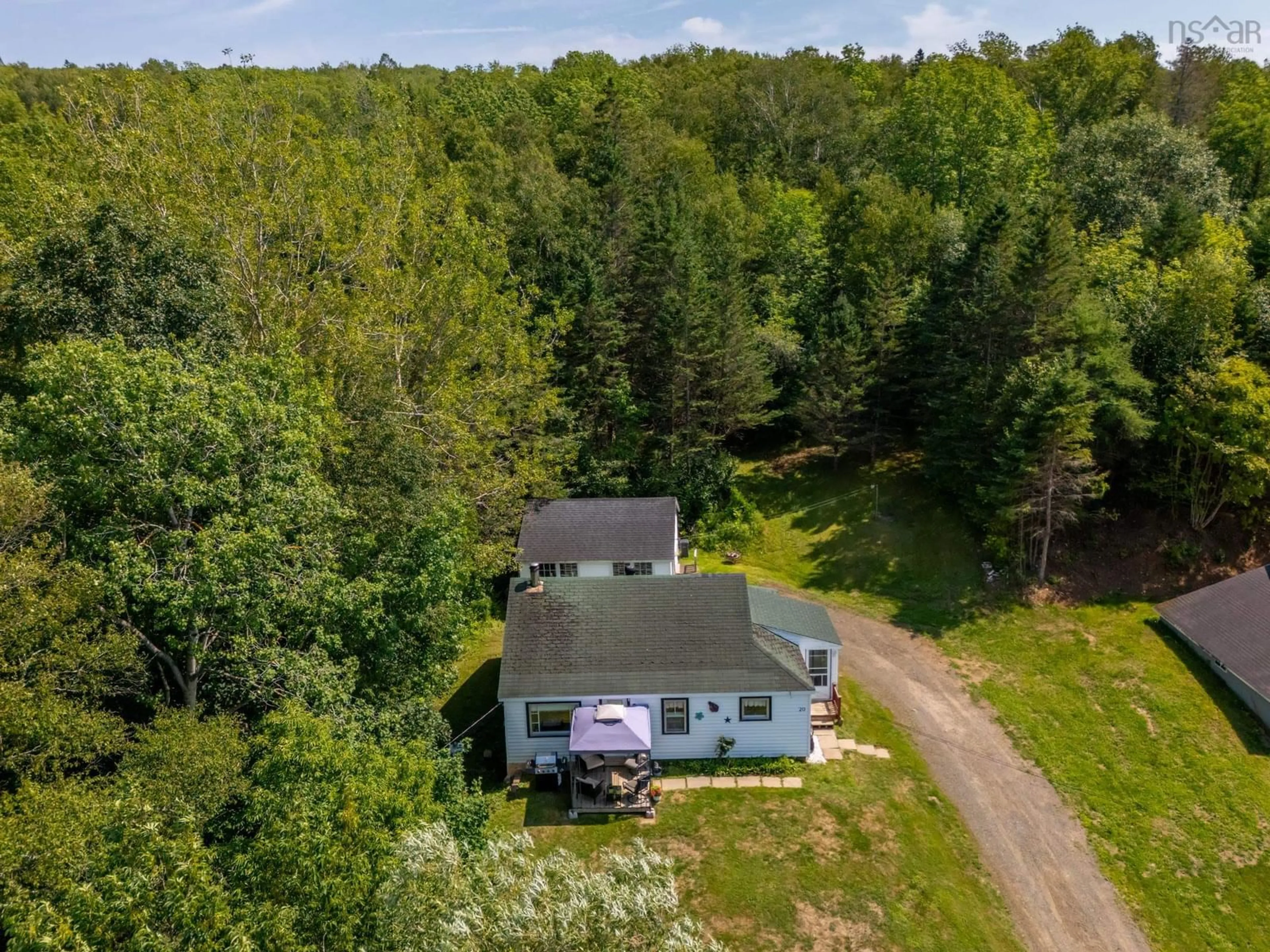 A pic from outside/outdoor area/front of a property/back of a property/a pic from drone, forest/trees view for 20 M And R St, Clementsport Nova Scotia B0S 1E0