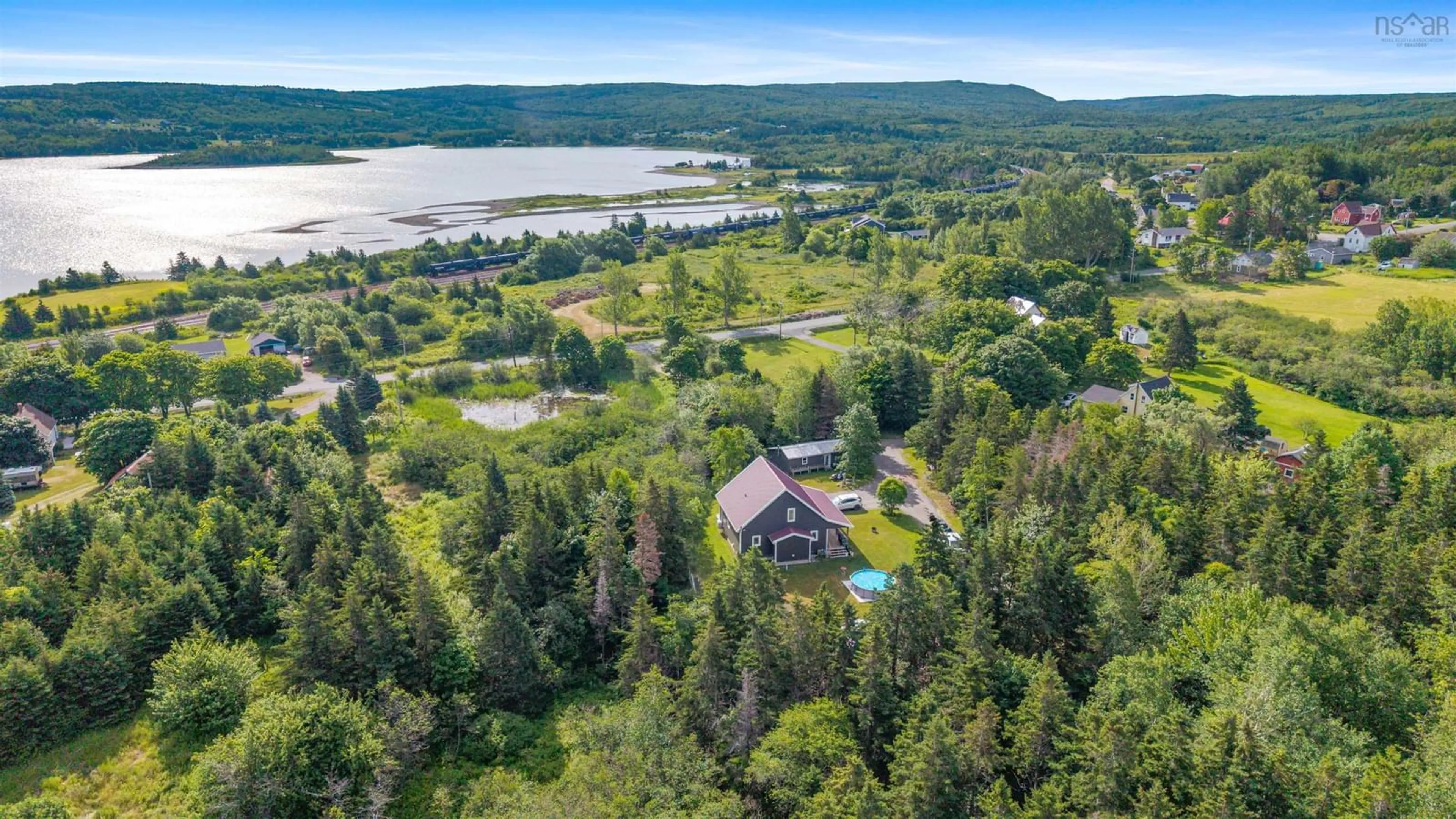 A pic from outside/outdoor area/front of a property/back of a property/a pic from drone, water/lake/river/ocean view for 1741 Havre Boucher Rd, Havre Boucher Nova Scotia B0H 1P0