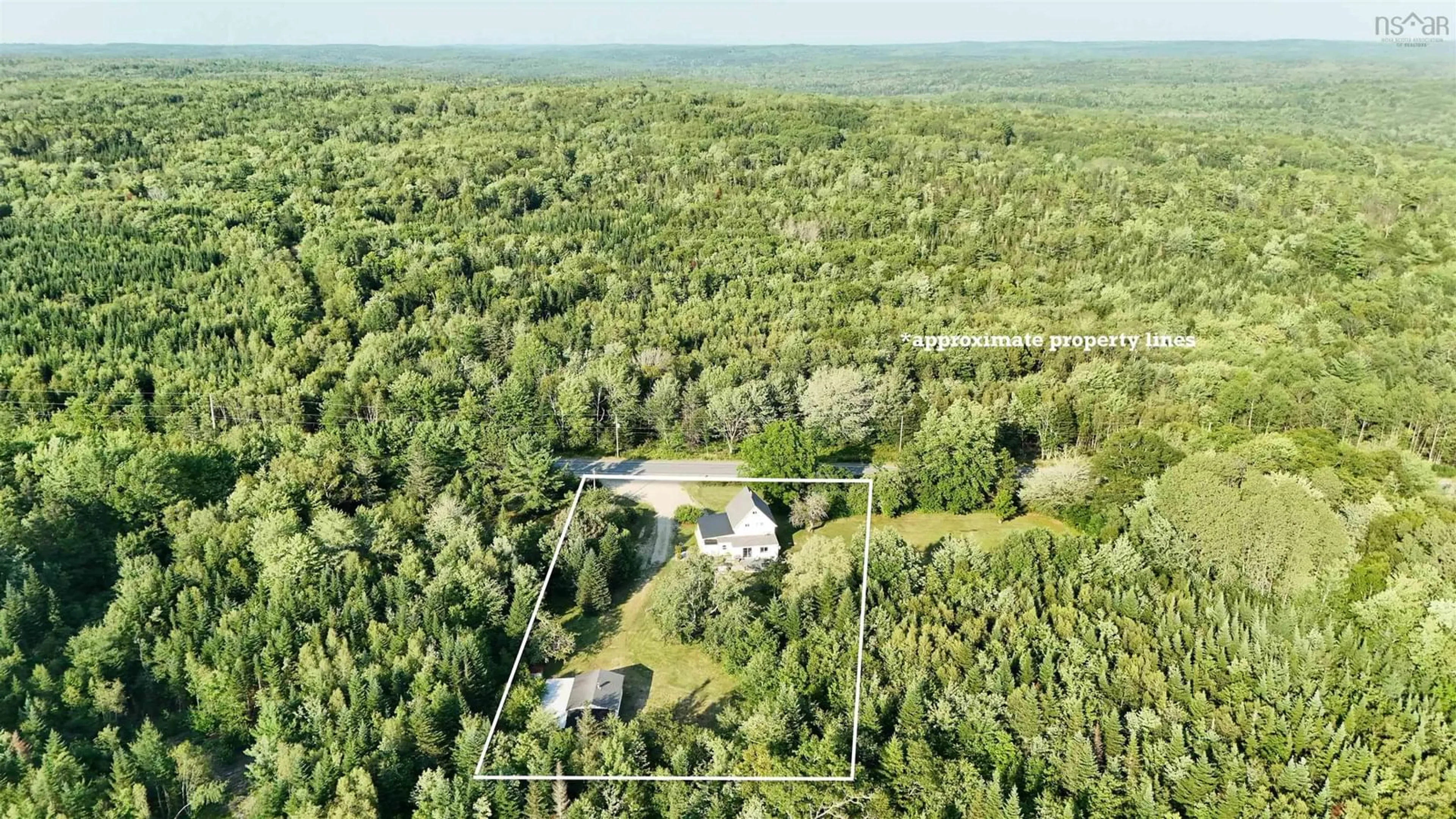 A pic from outside/outdoor area/front of a property/back of a property/a pic from drone, forest/trees view for 2921 Highway 12, Seffernsville Nova Scotia B0J 2M0