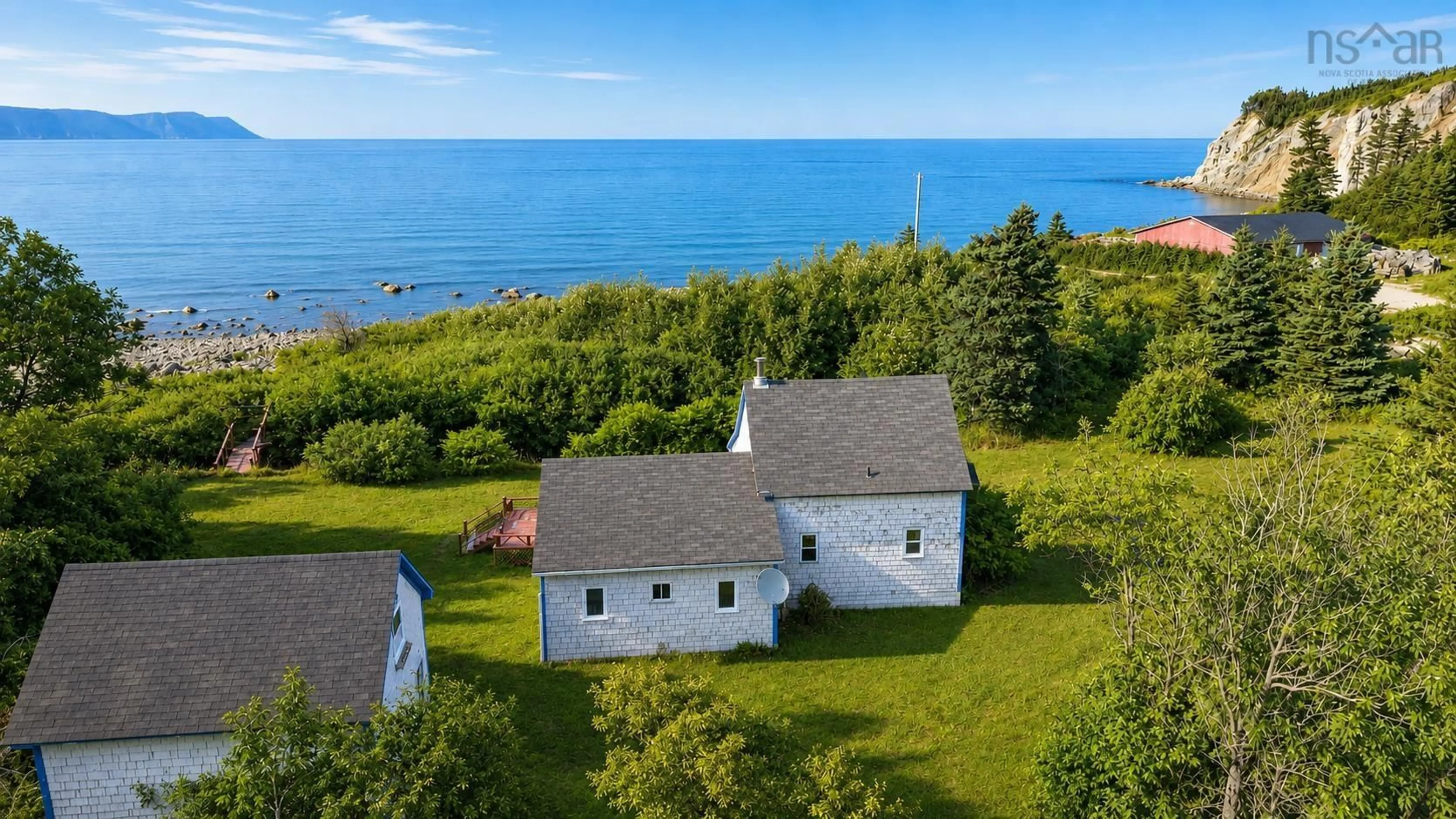 A pic from outside/outdoor area/front of a property/back of a property/a pic from drone, water/lake/river/ocean view for 1251 White Point Rd, Smelt Brook Nova Scotia B0C 1G0