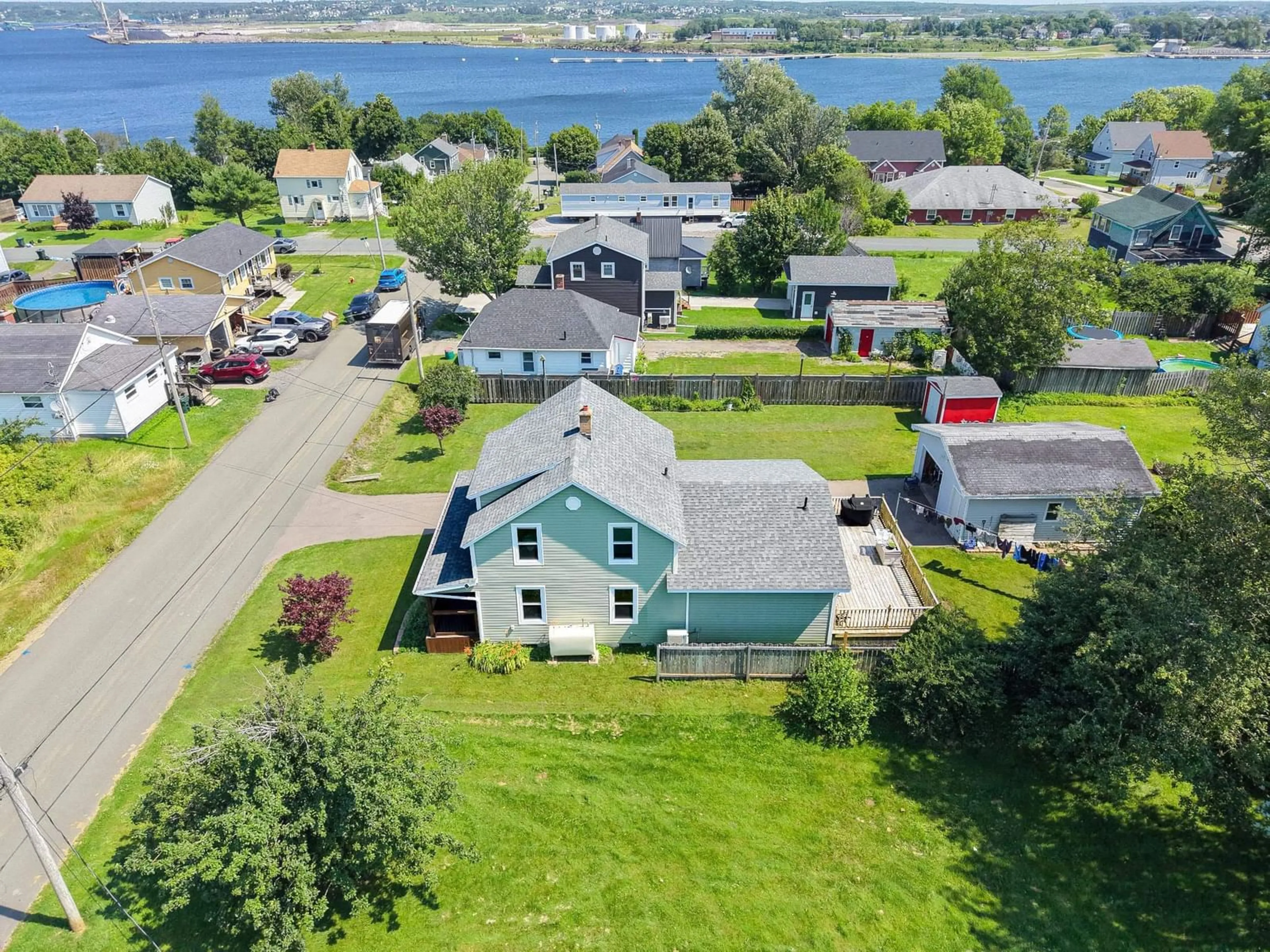 A pic from outside/outdoor area/front of a property/back of a property/a pic from drone, water/lake/river/ocean view for 55 Monteith Ave, Sydney Nova Scotia B1R 1K3