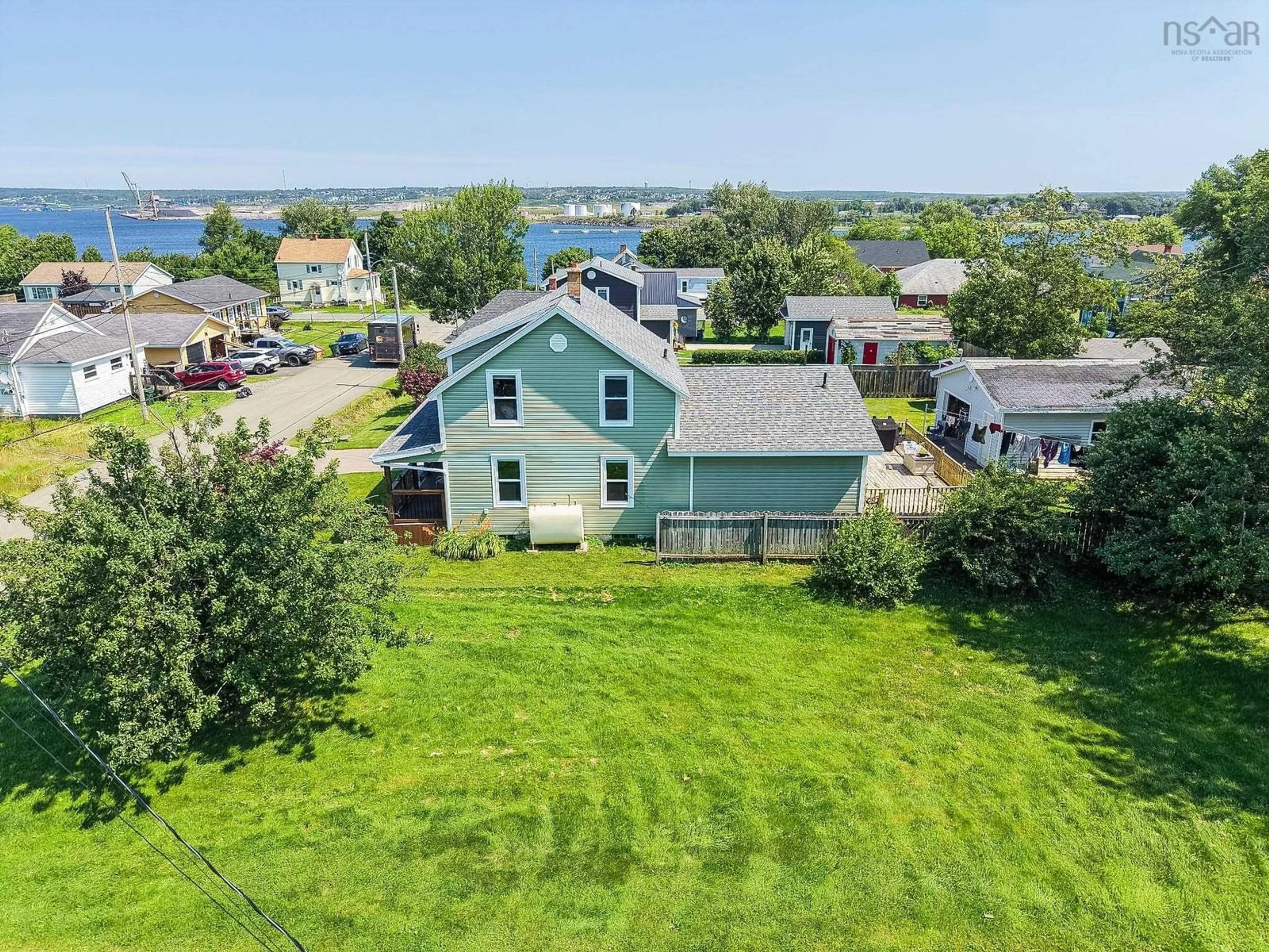 A pic from outside/outdoor area/front of a property/back of a property/a pic from drone, water/lake/river/ocean view for 55 Monteith Ave, Sydney Nova Scotia B1R 1K3