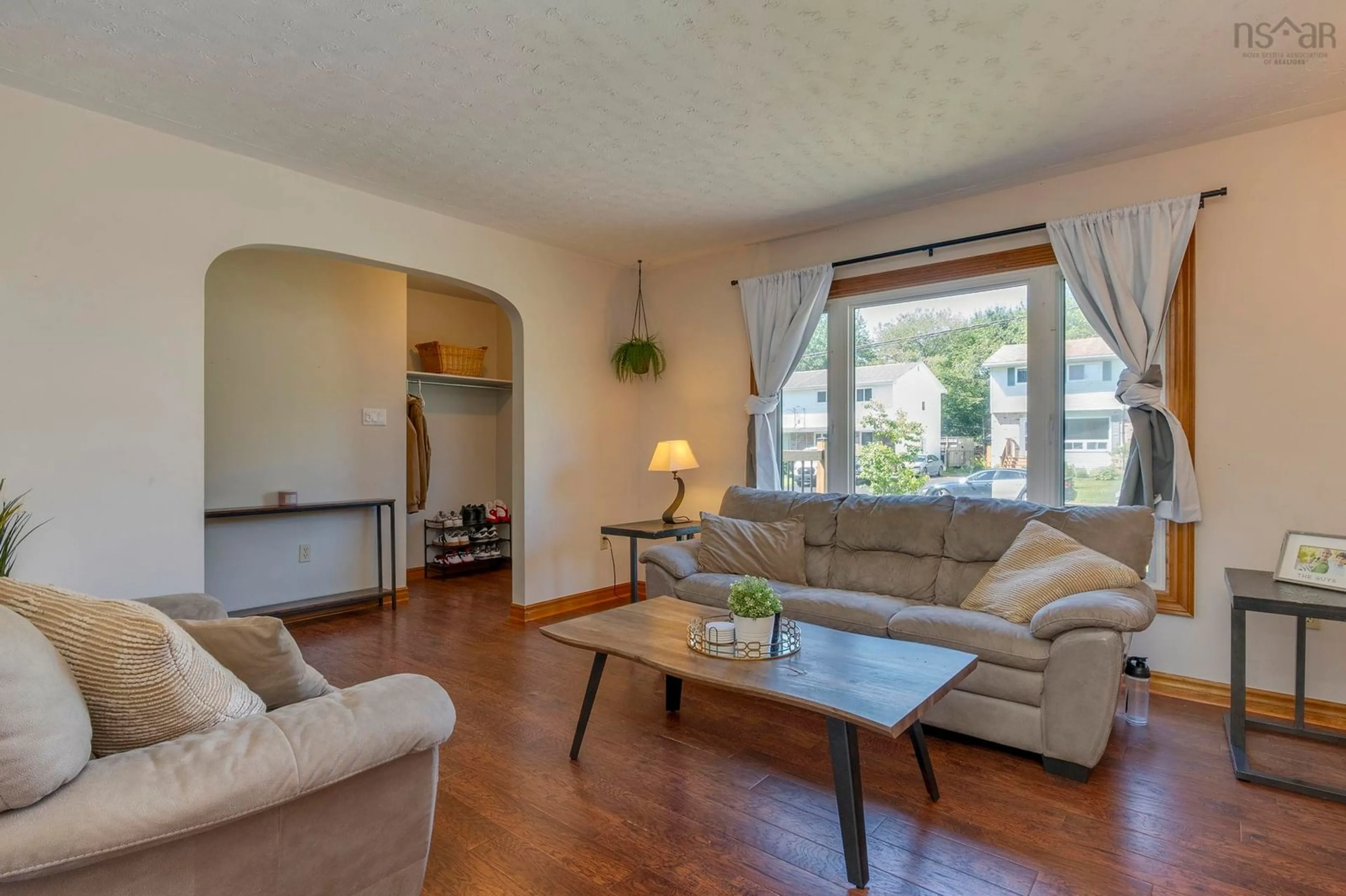 Living room with furniture, wood/laminate floor for 89 Taranaki Dr, Dartmouth Nova Scotia B2W 4X3