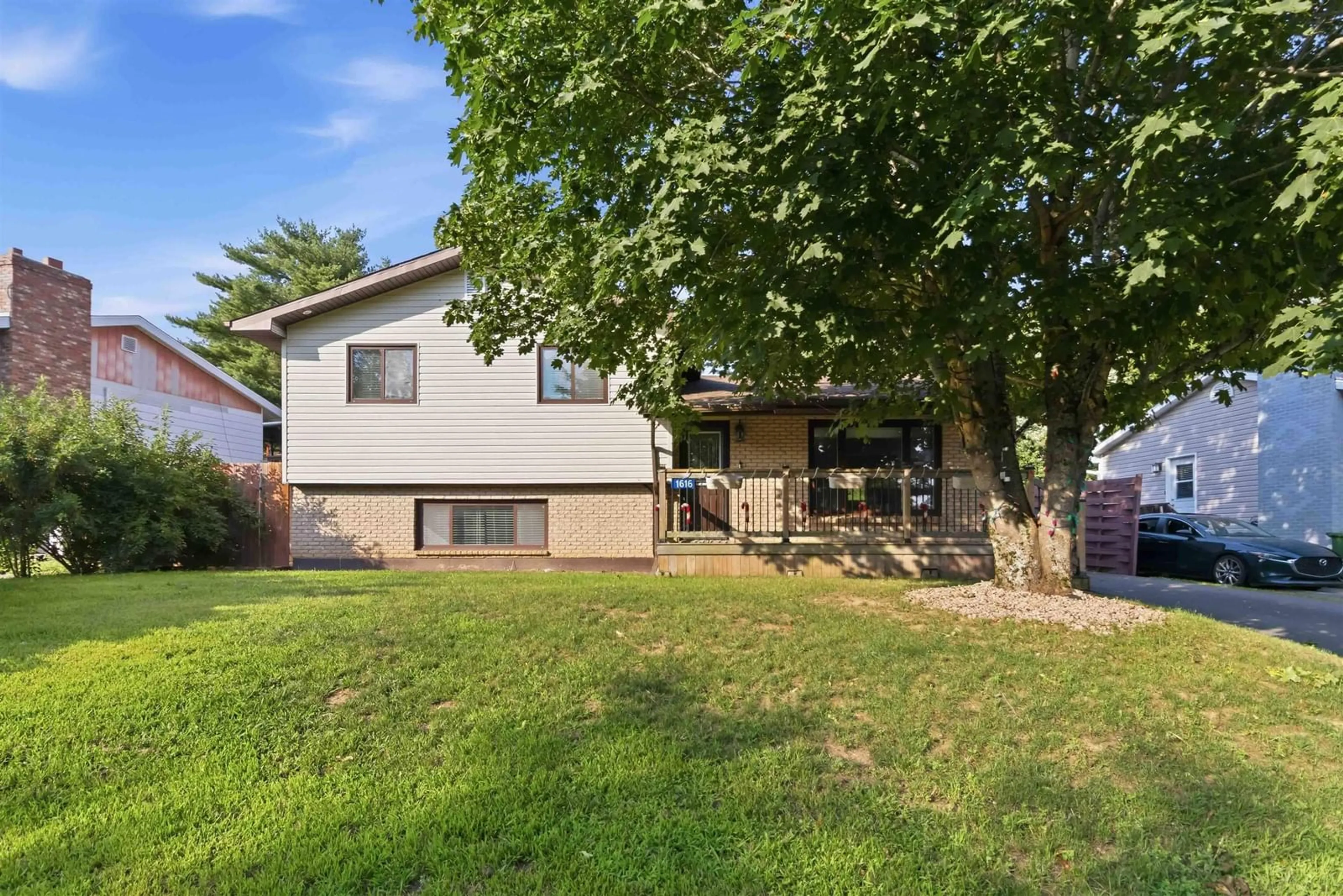 Home with vinyl exterior material, street for 1616 Riverside Drive, Lower Sackville Nova Scotia B4C 2Y8