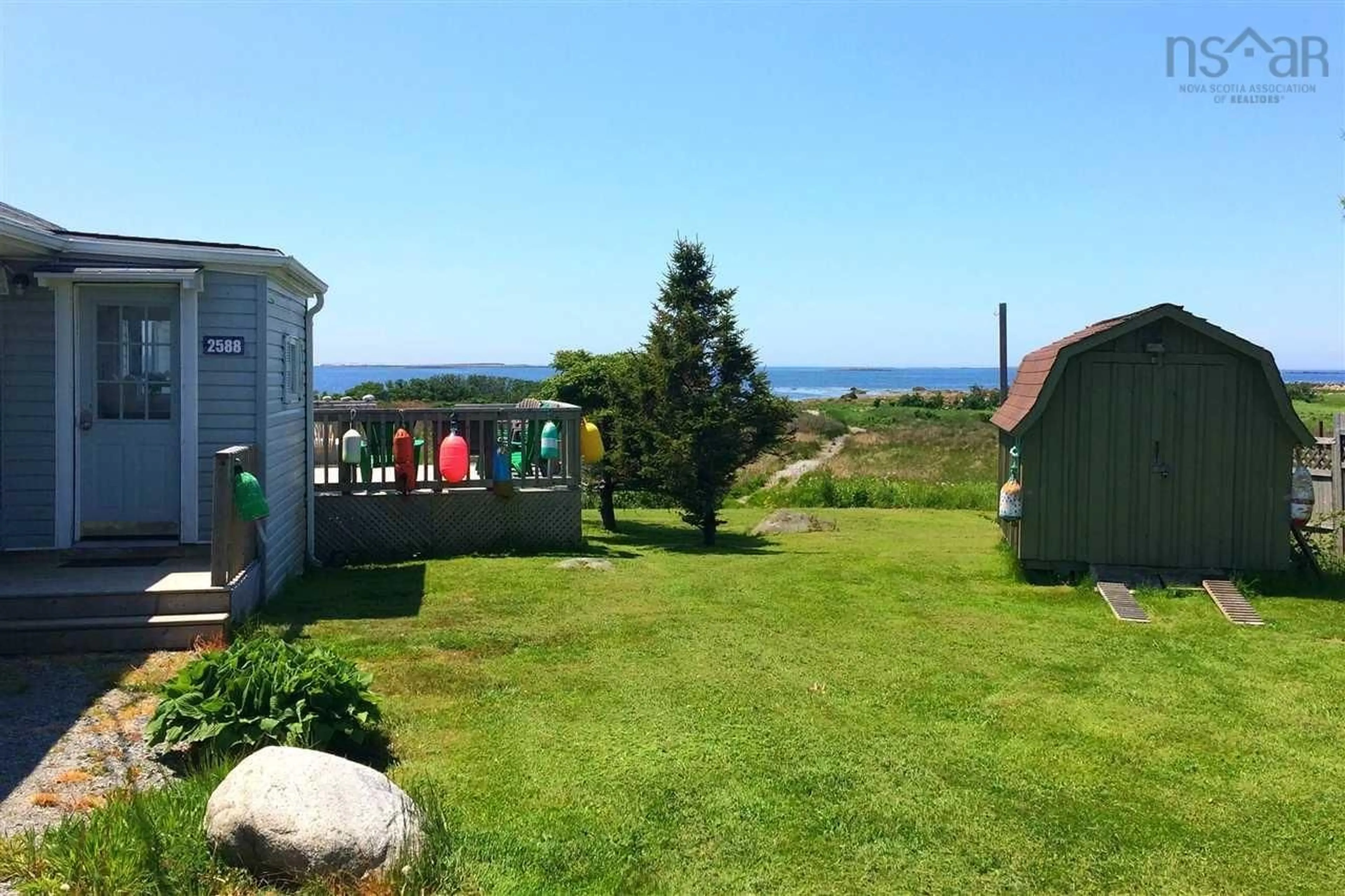 A pic from outside/outdoor area/front of a property/back of a property/a pic from drone, water/lake/river/ocean view for 2588 Main St, Clark's Harbour Nova Scotia B0W 1P0