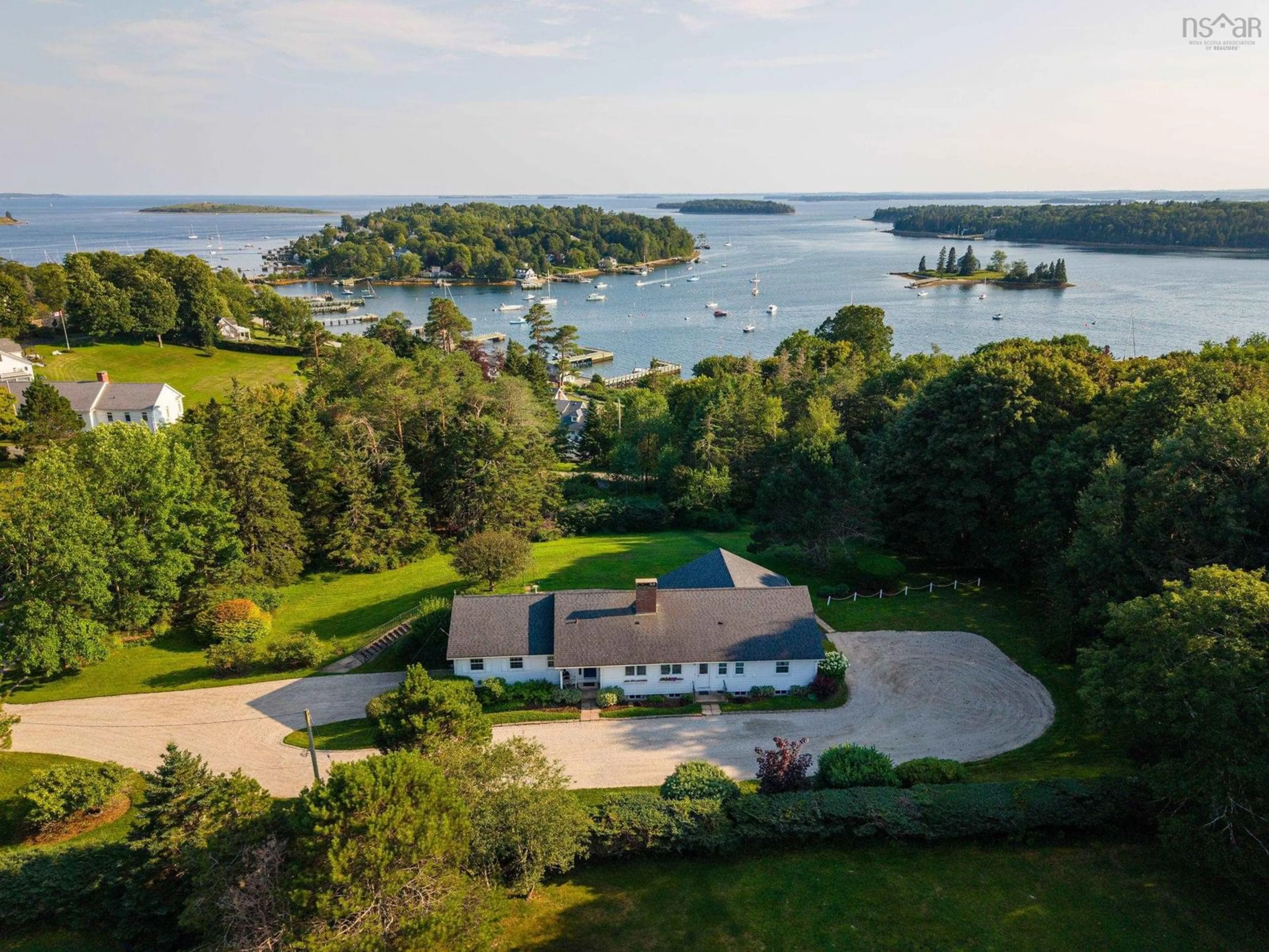 A pic from outside/outdoor area/front of a property/back of a property/a pic from drone, water/lake/river/ocean view for 121 Victoria St, Chester Nova Scotia B0J 1J0