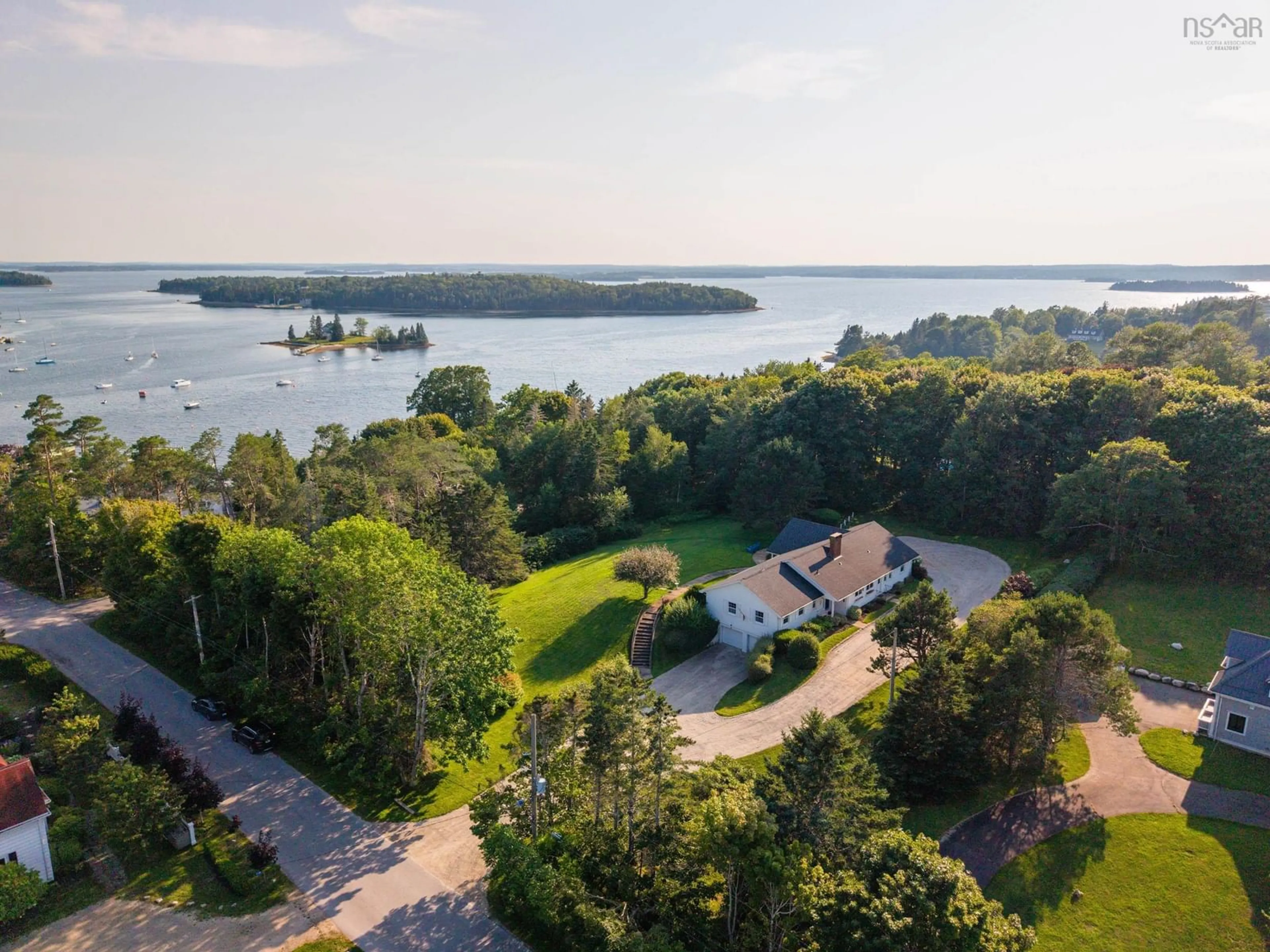 A pic from outside/outdoor area/front of a property/back of a property/a pic from drone, water/lake/river/ocean view for 121 Victoria St, Chester Nova Scotia B0J 1J0