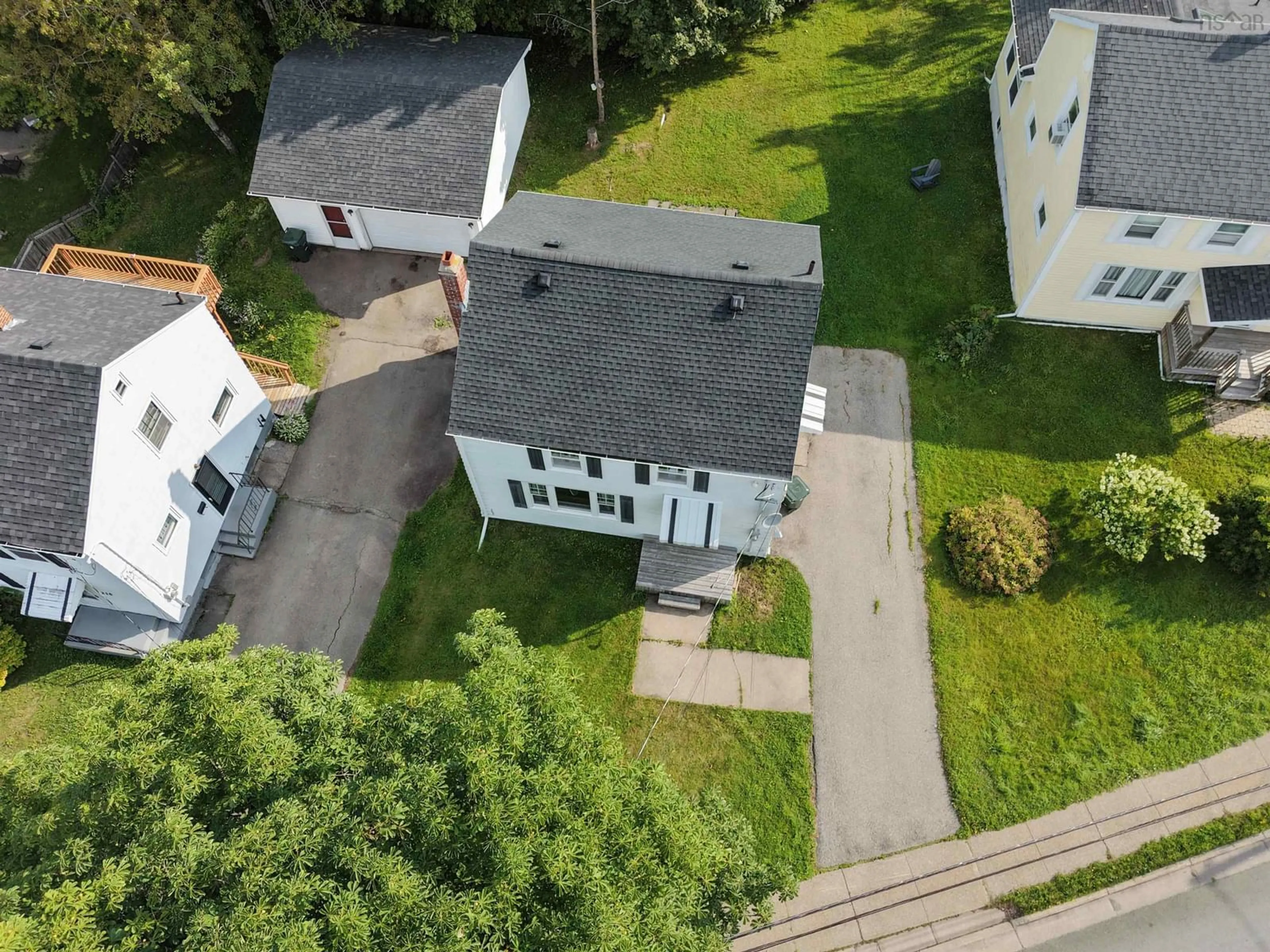 A pic from outside/outdoor area/front of a property/back of a property/a pic from drone, street for 221 Cottage Rd, Sydney Nova Scotia B1P 2E7