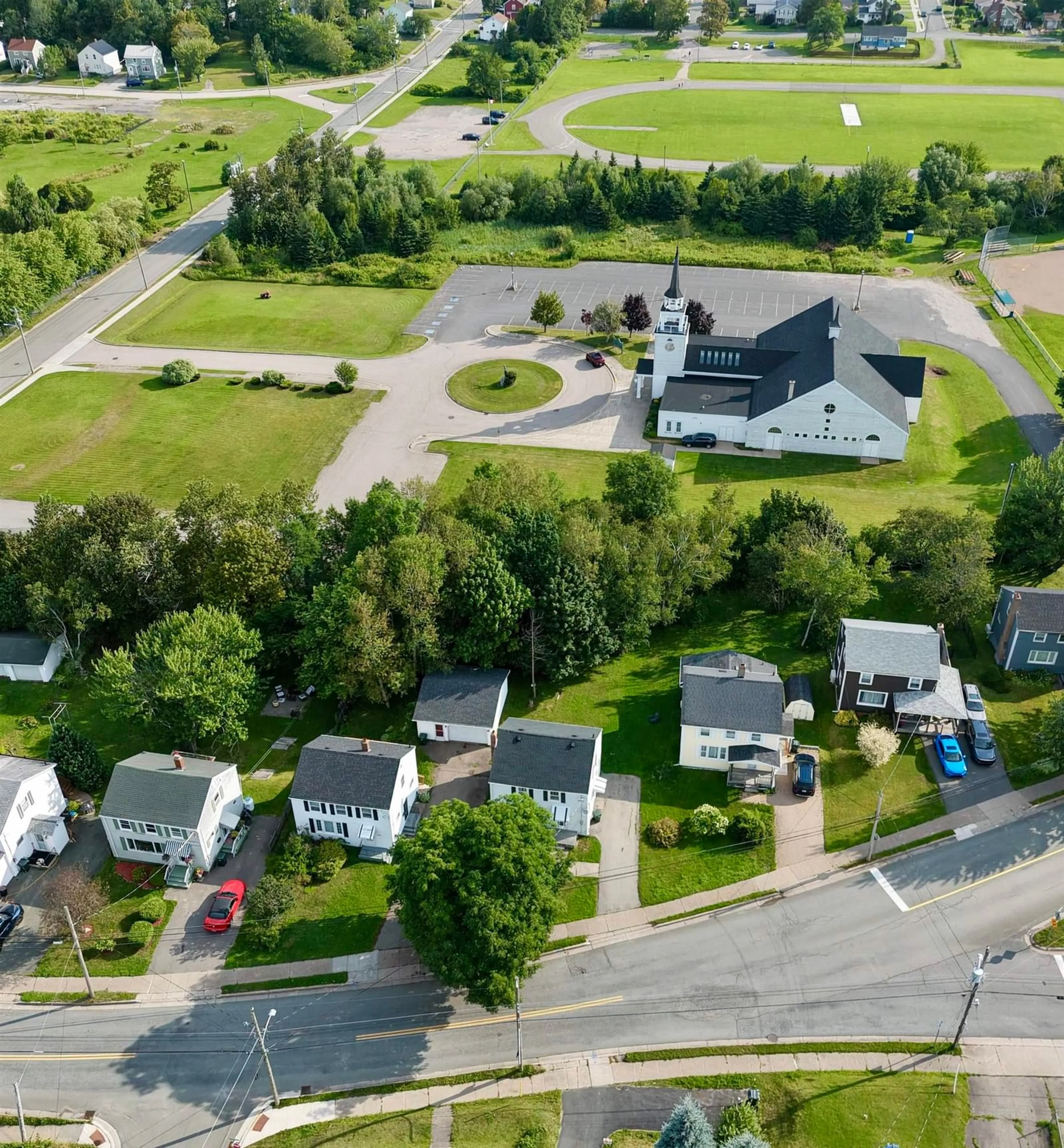 A pic from outside/outdoor area/front of a property/back of a property/a pic from drone, street for 221 Cottage Rd, Sydney Nova Scotia B1P 2E7
