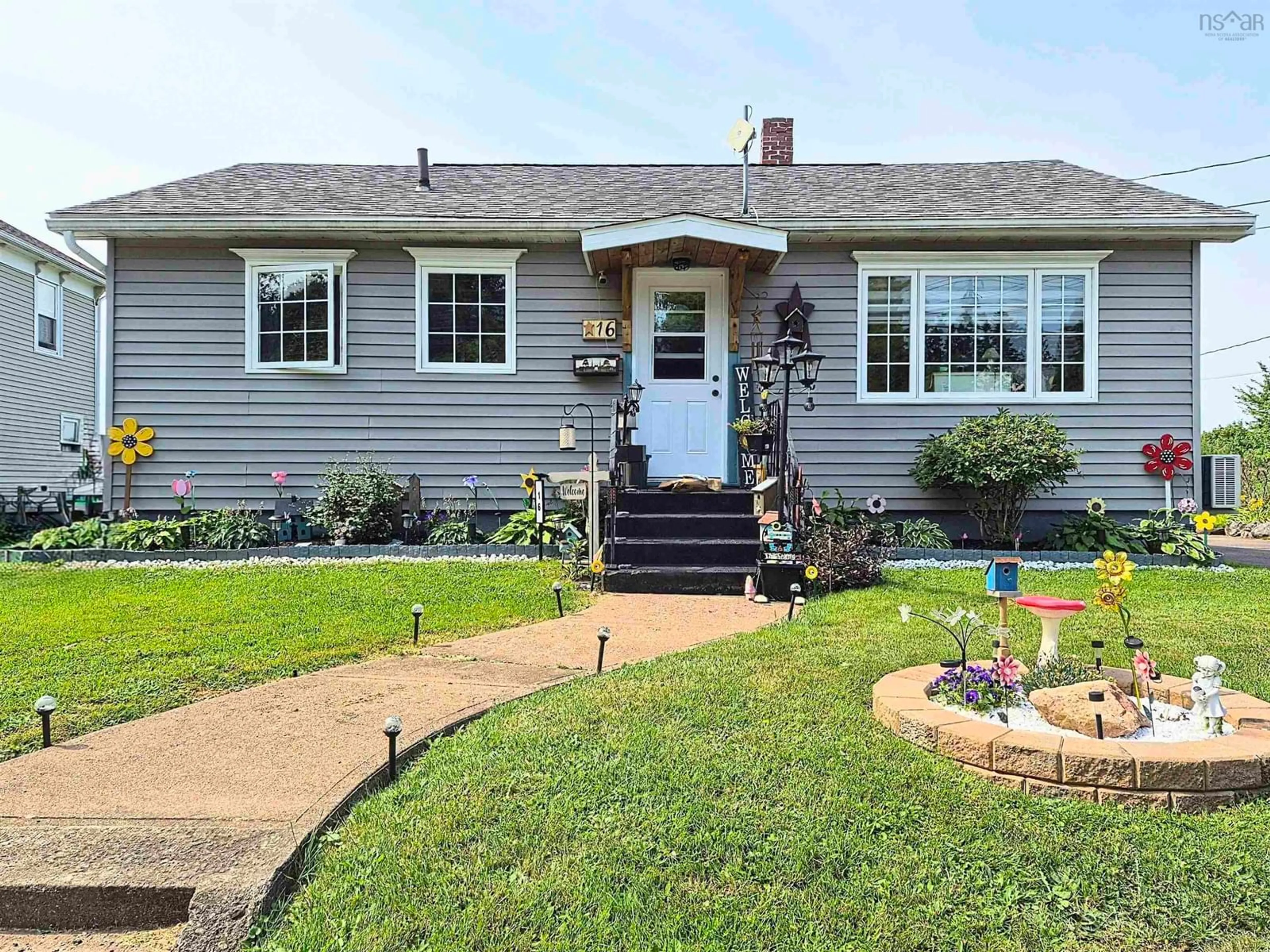 Home with vinyl exterior material, street for 16 Copp Ave, Amherst Nova Scotia B4H 2T4