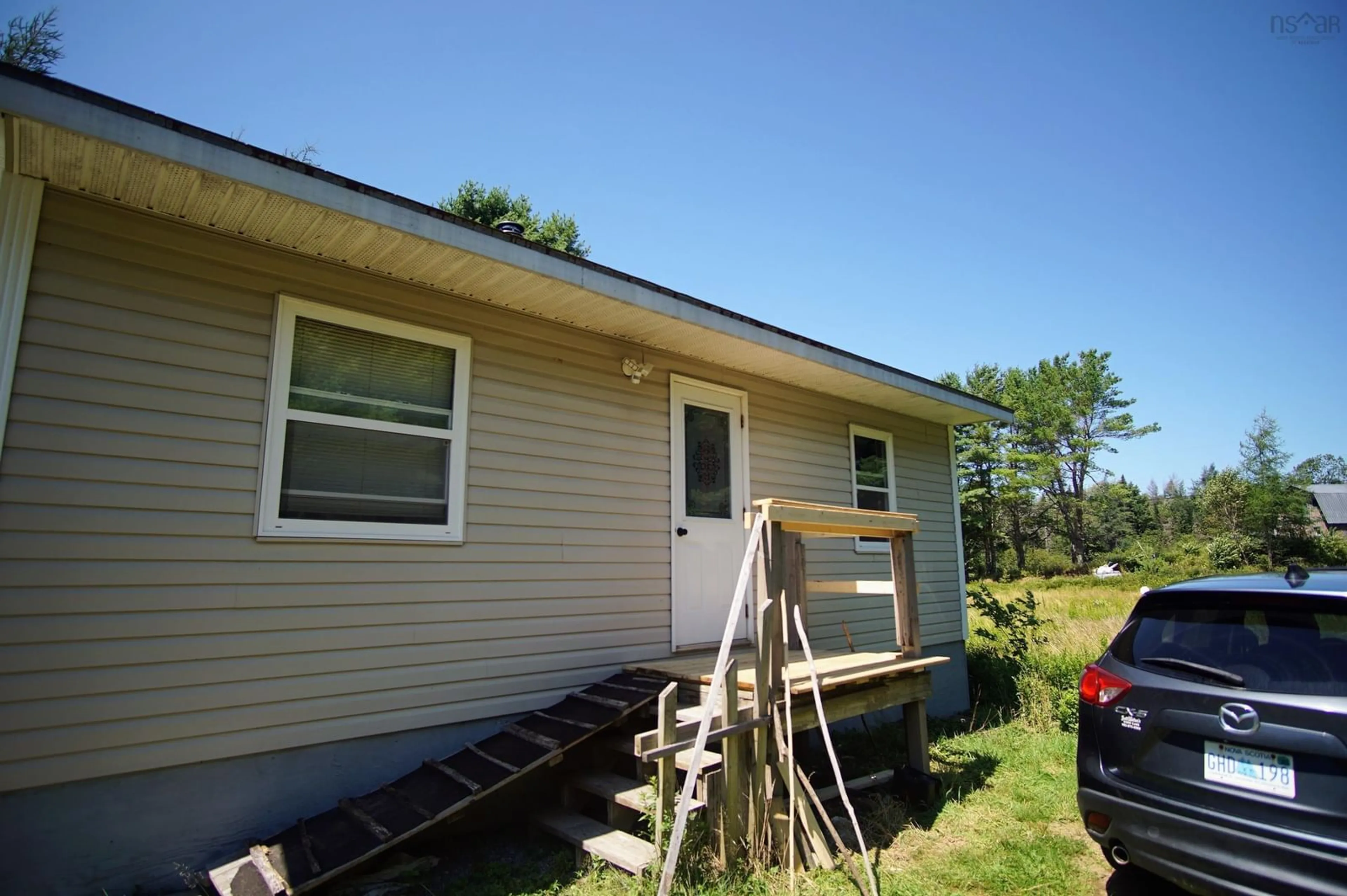 Home with vinyl exterior material, building for 6816 Upper Clyde Rd, Upper Clyde River Nova Scotia B0T 1W0