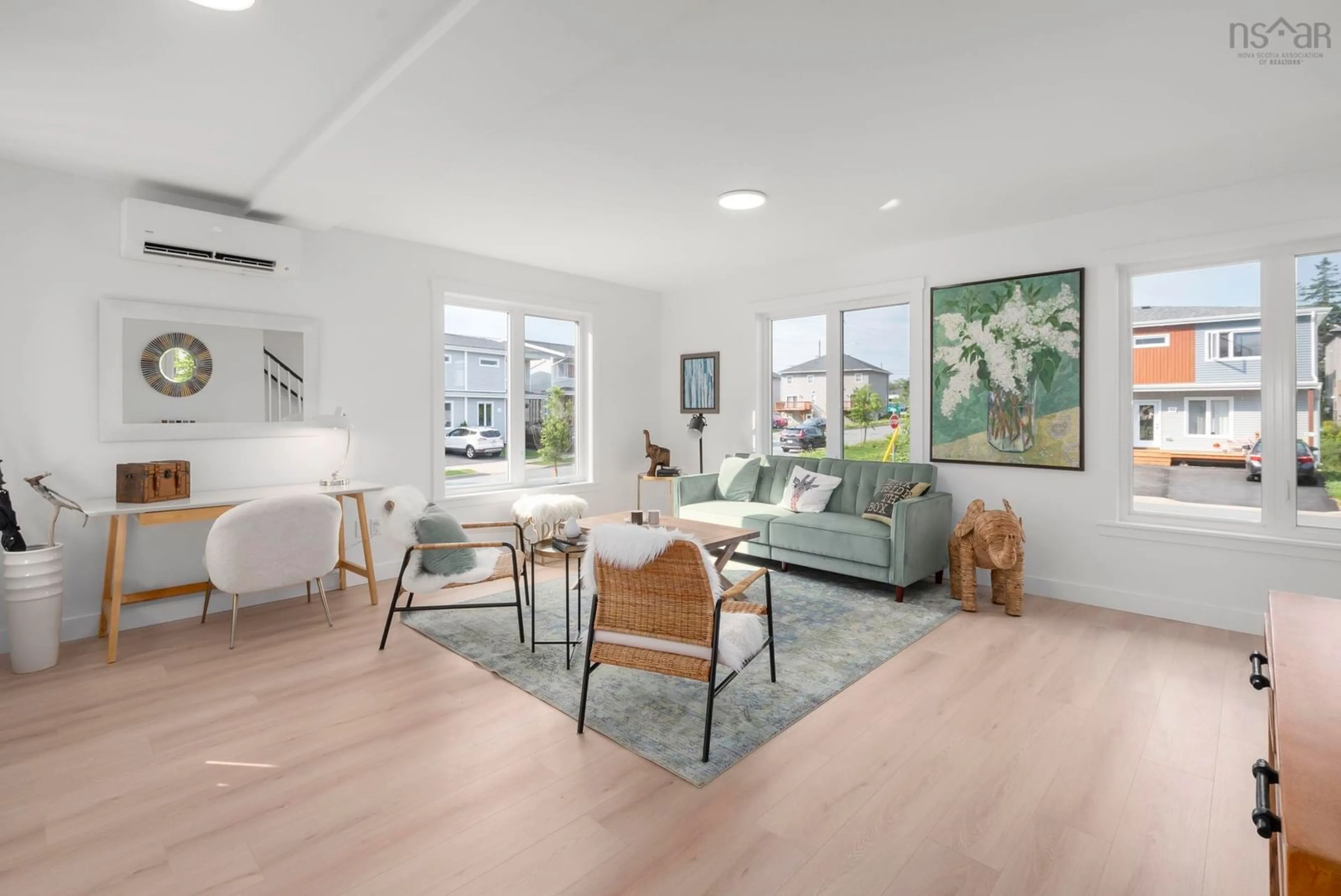 Living room with furniture, wood/laminate floor for 52 Berm St, Herring Cove Nova Scotia B3R 0H2