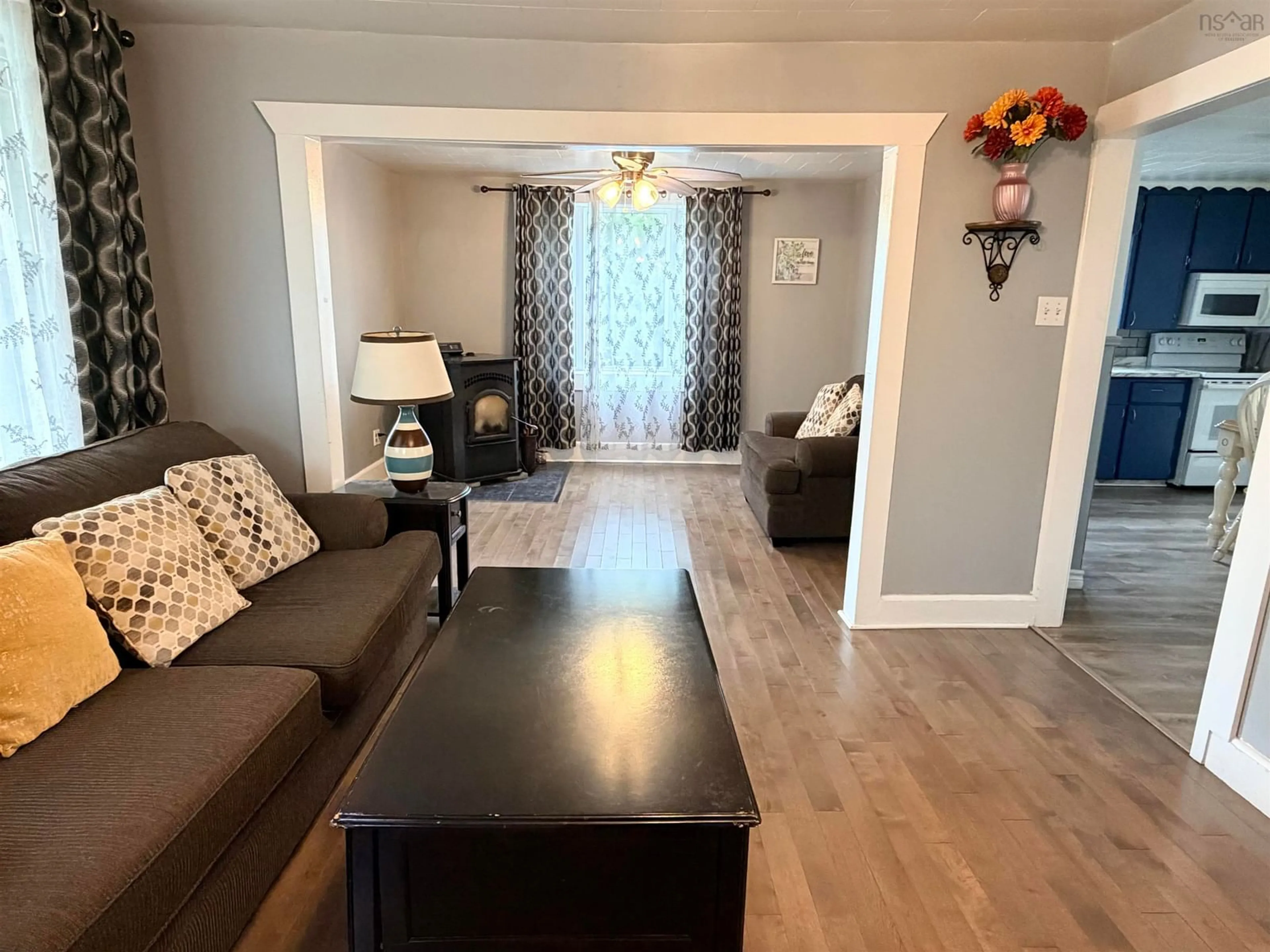 Living room with furniture, wood/laminate floor for 626 St. Joseph St, New Waterford Nova Scotia B1H 4G8