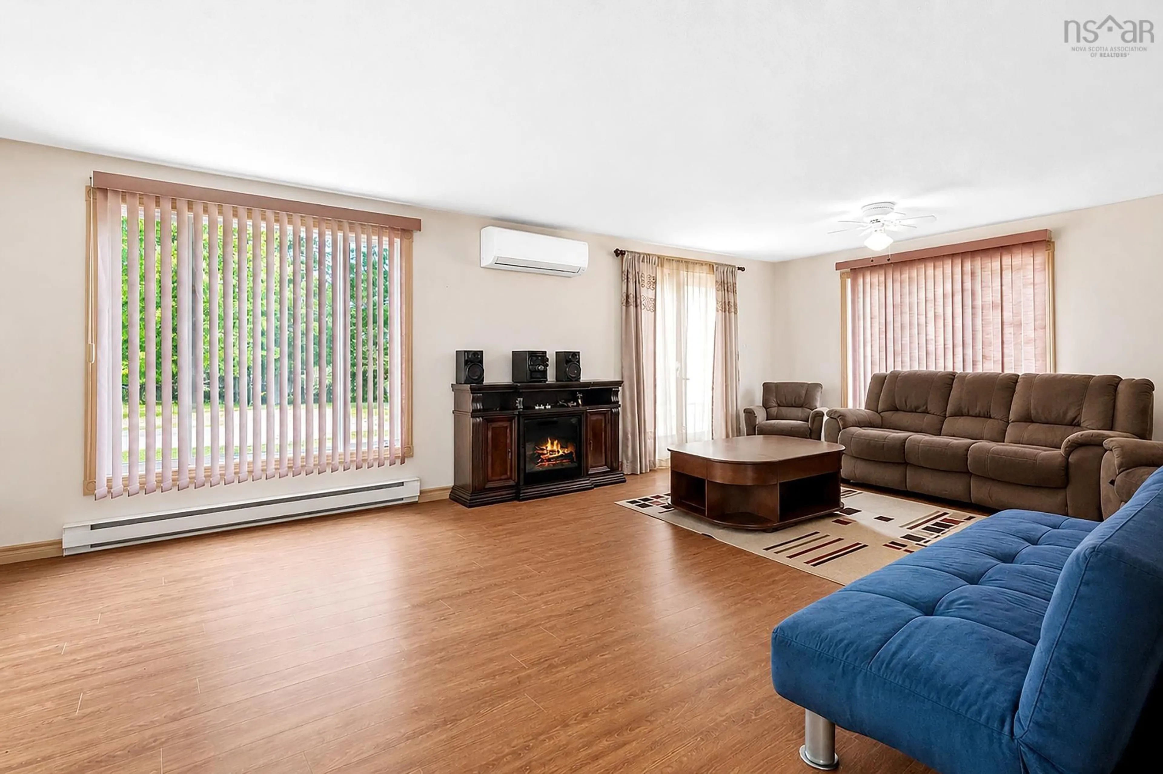 Living room with furniture, wood/laminate floor for 22 Maple Lane, Wileville Nova Scotia B4V 5H9
