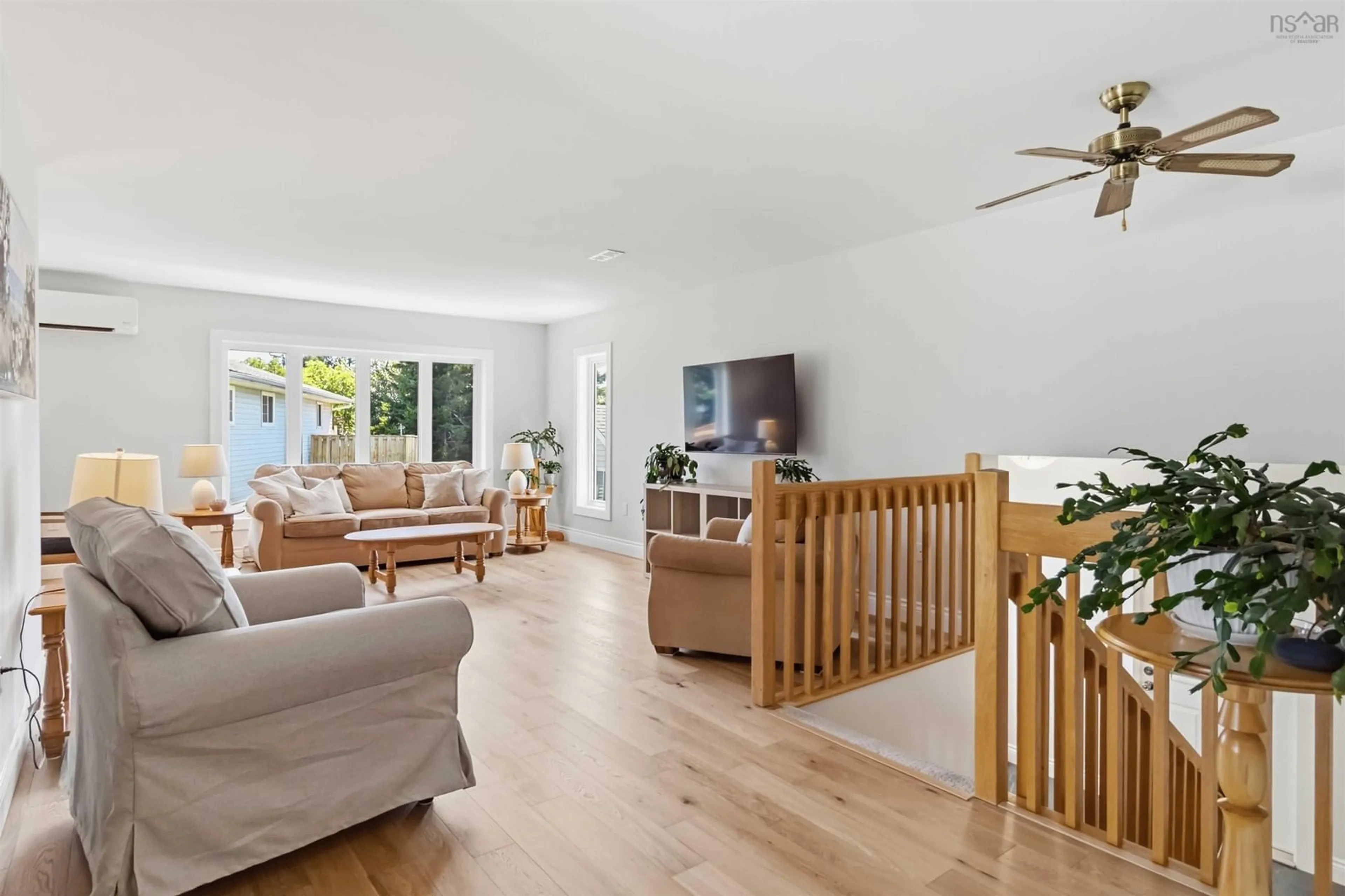 Living room with furniture, wood/laminate floor for 281 Cow Bay Rd, Eastern Passage Nova Scotia B3G 1C4