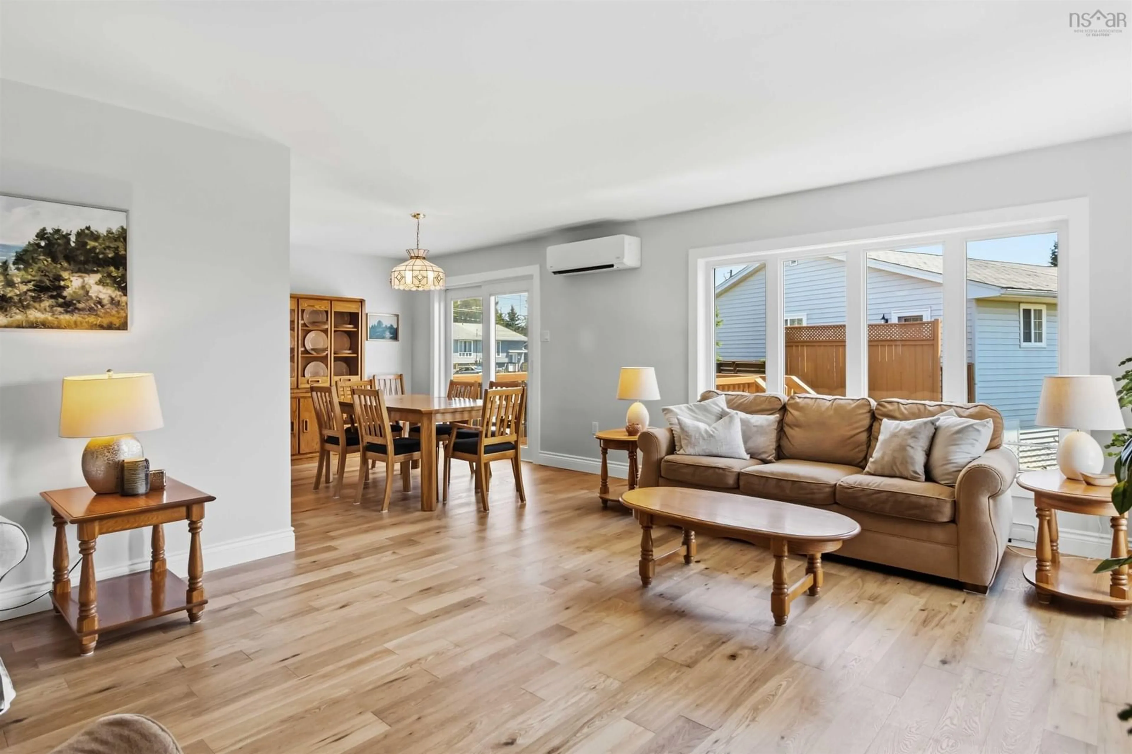 Living room with furniture, wood/laminate floor for 281 Cow Bay Rd, Eastern Passage Nova Scotia B3G 1C4