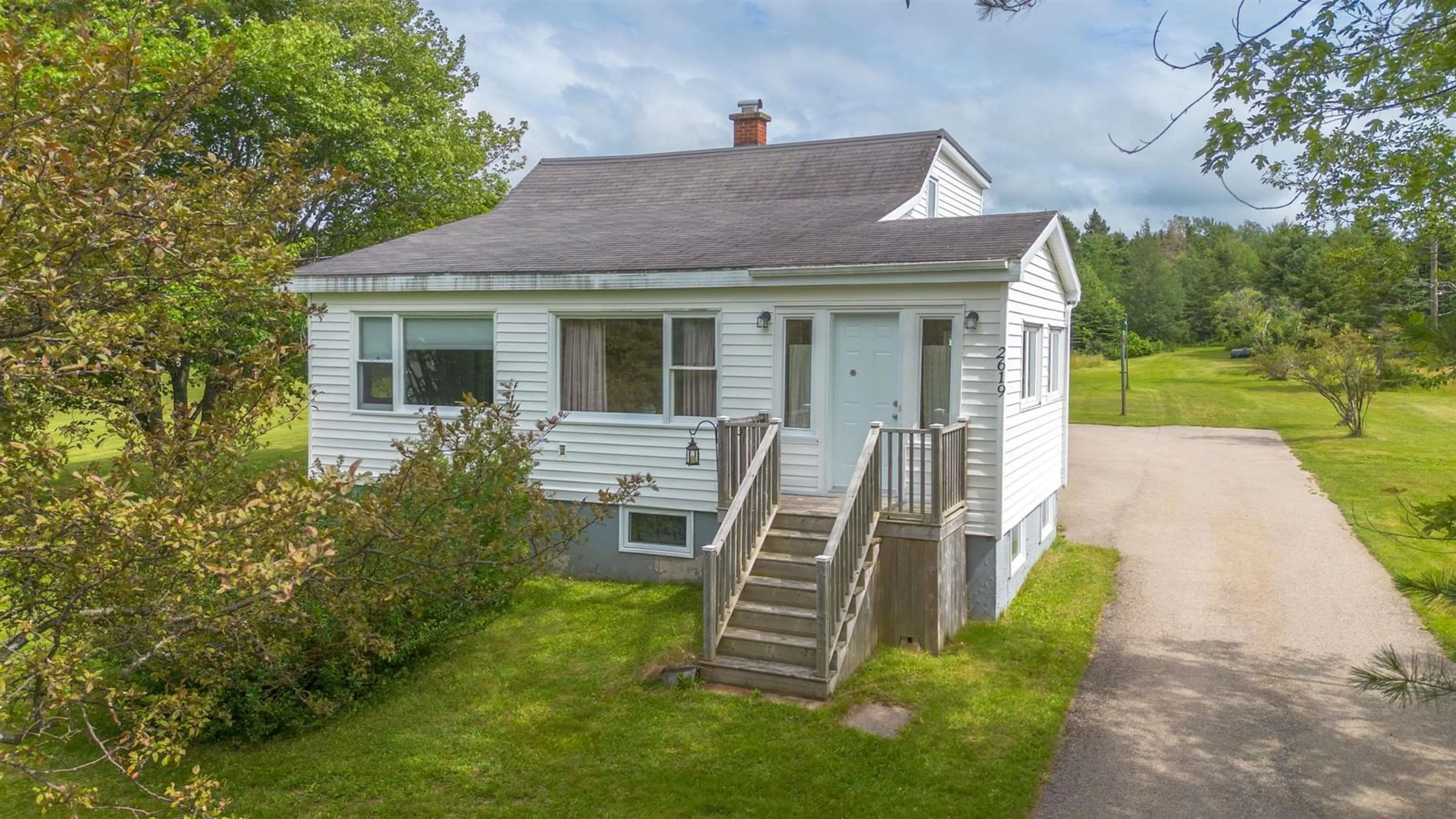 Home with vinyl exterior material, street for 2619 Kings Rd, Sydney Forks Nova Scotia B1L 1A1