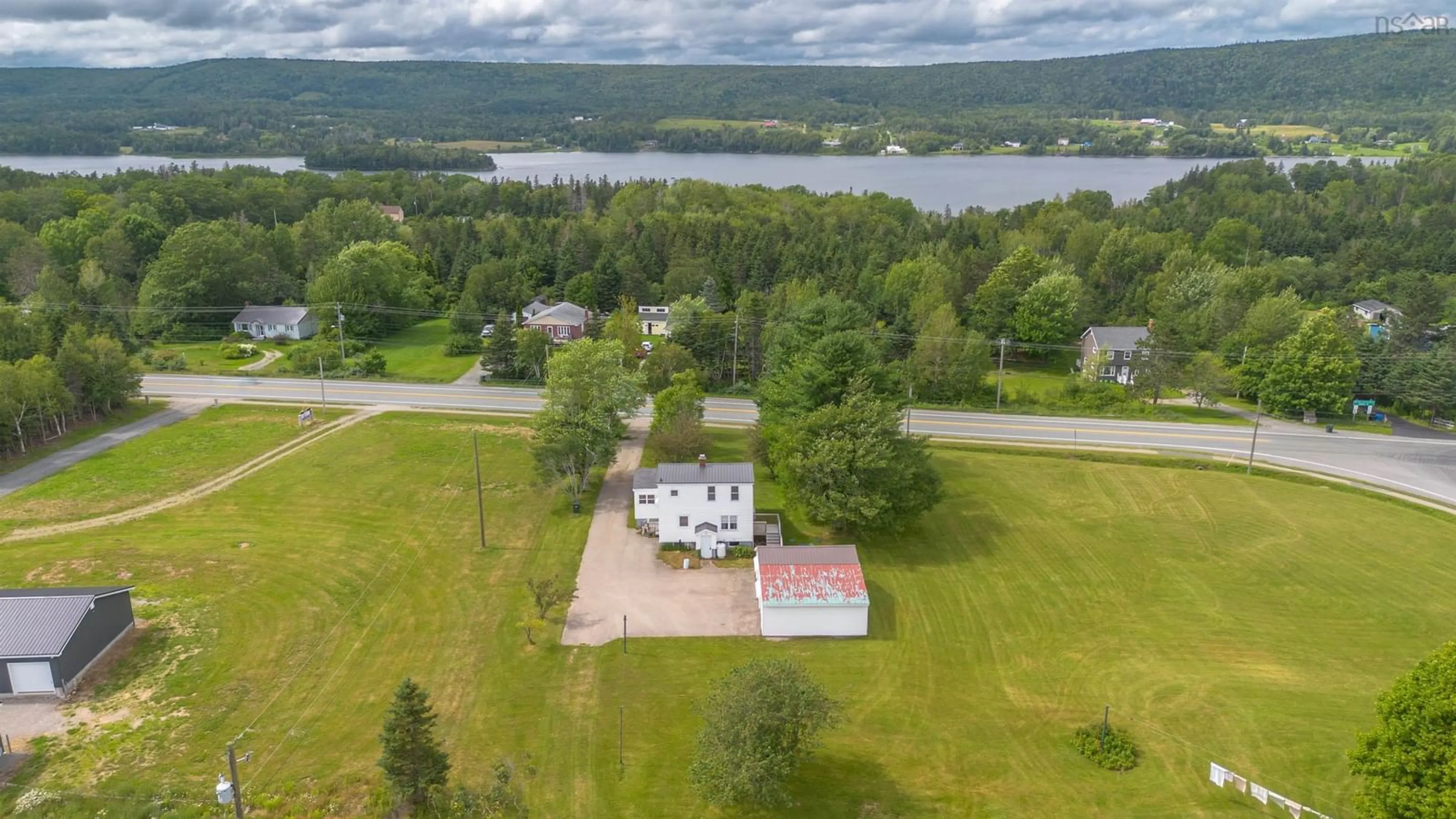 A pic from outside/outdoor area/front of a property/back of a property/a pic from drone, water/lake/river/ocean view for 2619 Kings Rd, Sydney Forks Nova Scotia B1L 1A1