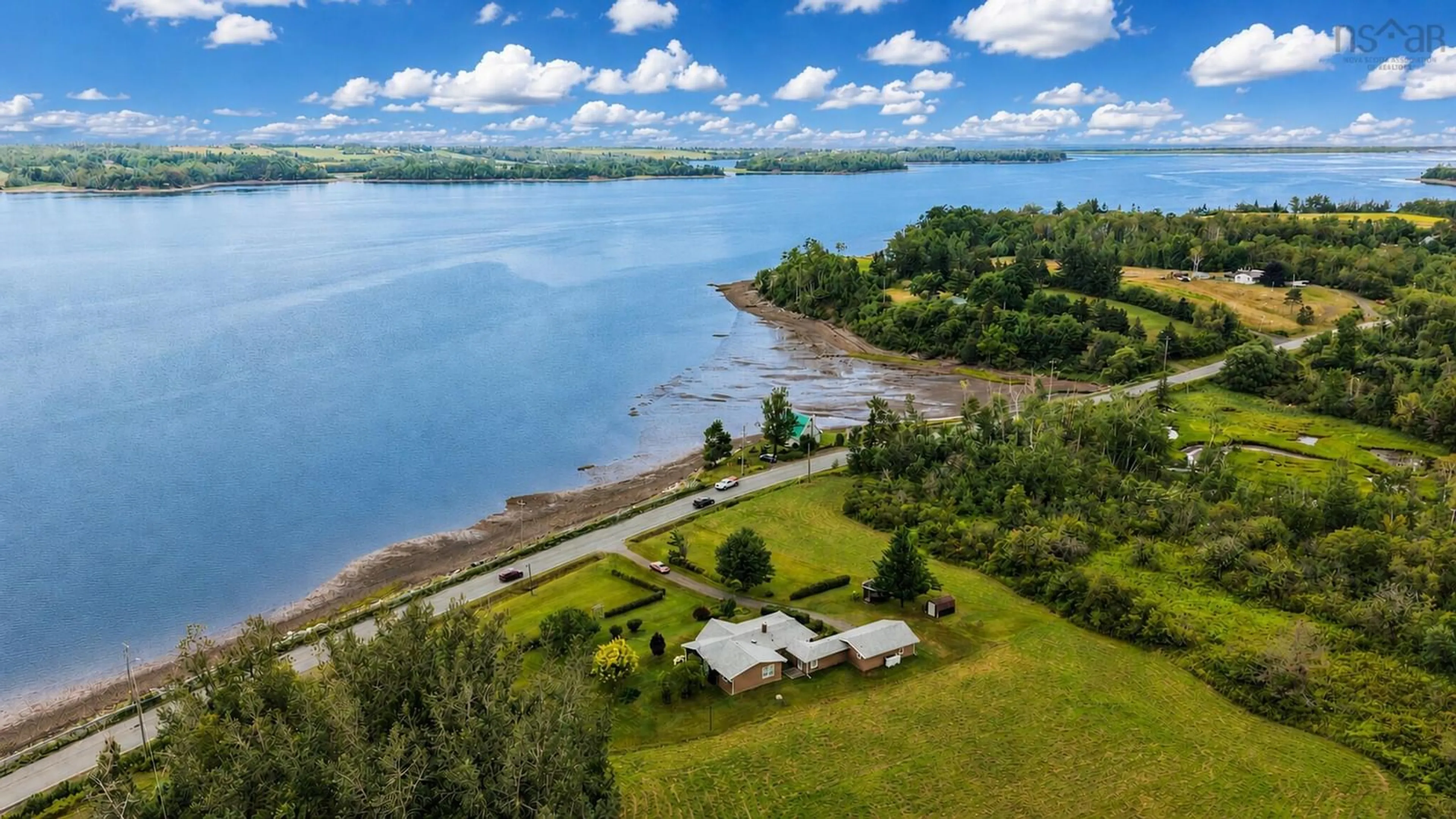 A pic from outside/outdoor area/front of a property/back of a property/a pic from drone, water/lake/river/ocean view for 1952 Shore Rd, Merigomish Nova Scotia B0K 1G0