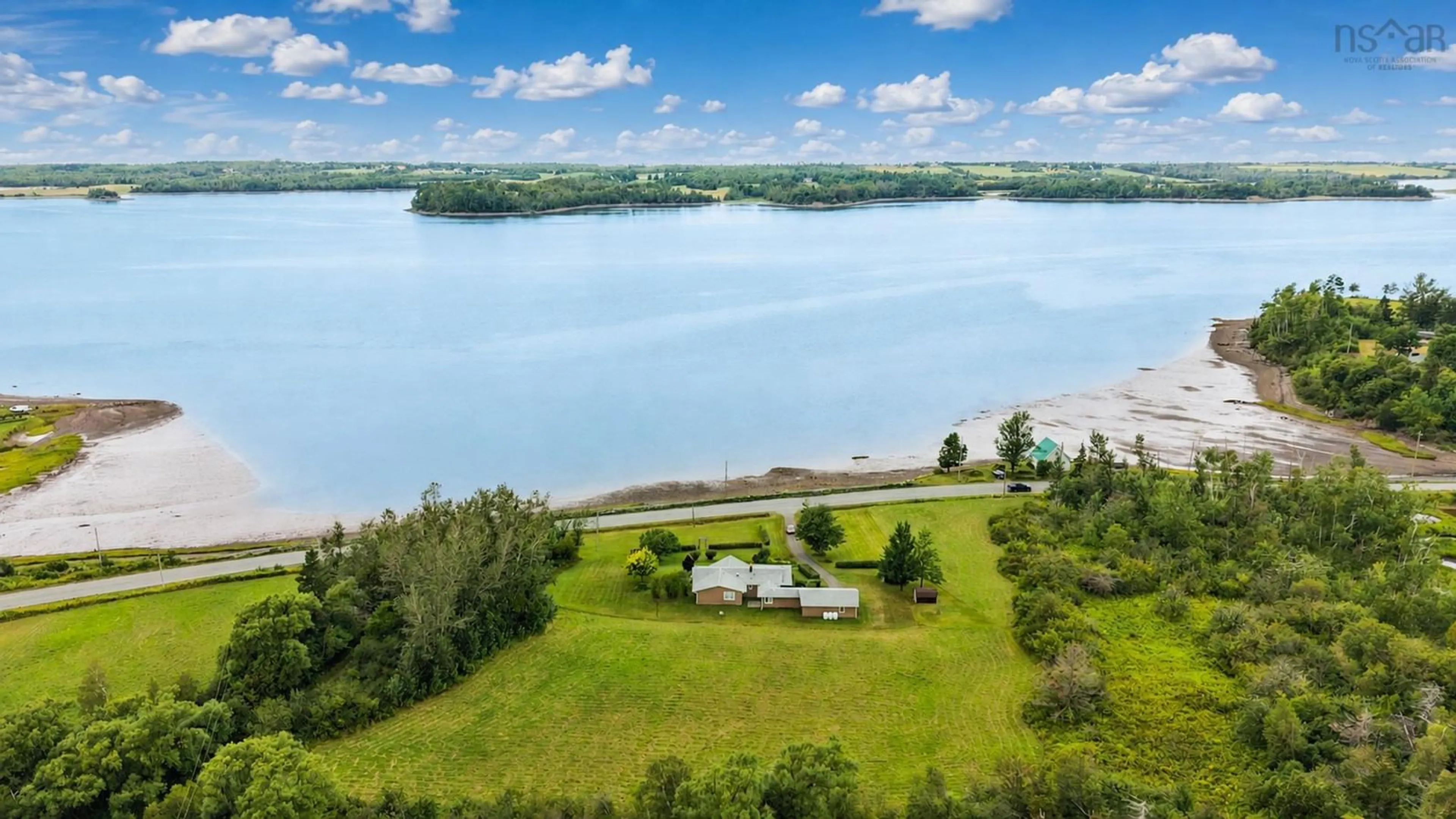 A pic from outside/outdoor area/front of a property/back of a property/a pic from drone, water/lake/river/ocean view for 1952 Shore Rd, Merigomish Nova Scotia B0K 1G0