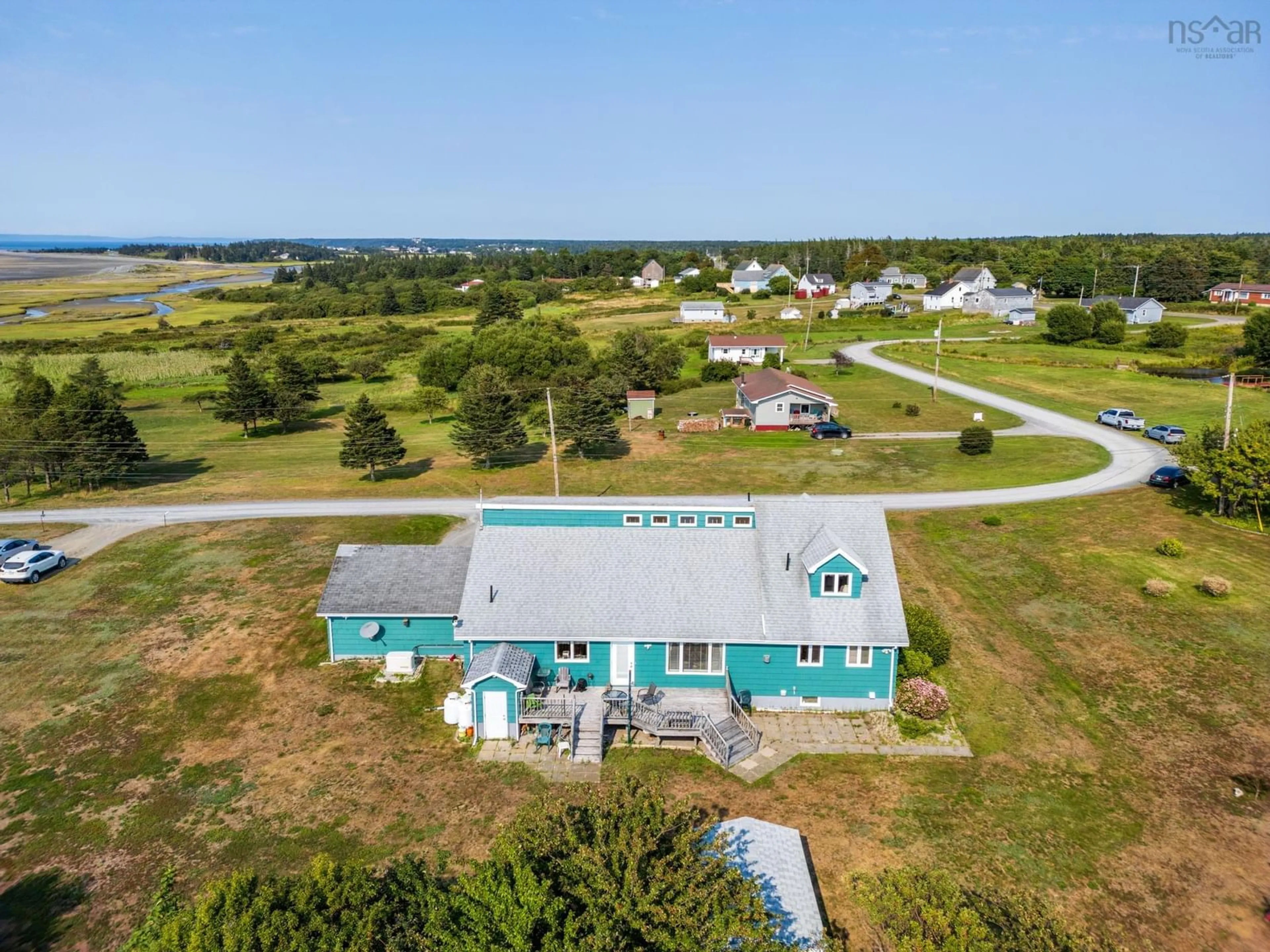 A pic from outside/outdoor area/front of a property/back of a property/a pic from drone, water/lake/river/ocean view for 92 Dixon Rd, Grosses Coques Nova Scotia B0W 1M0
