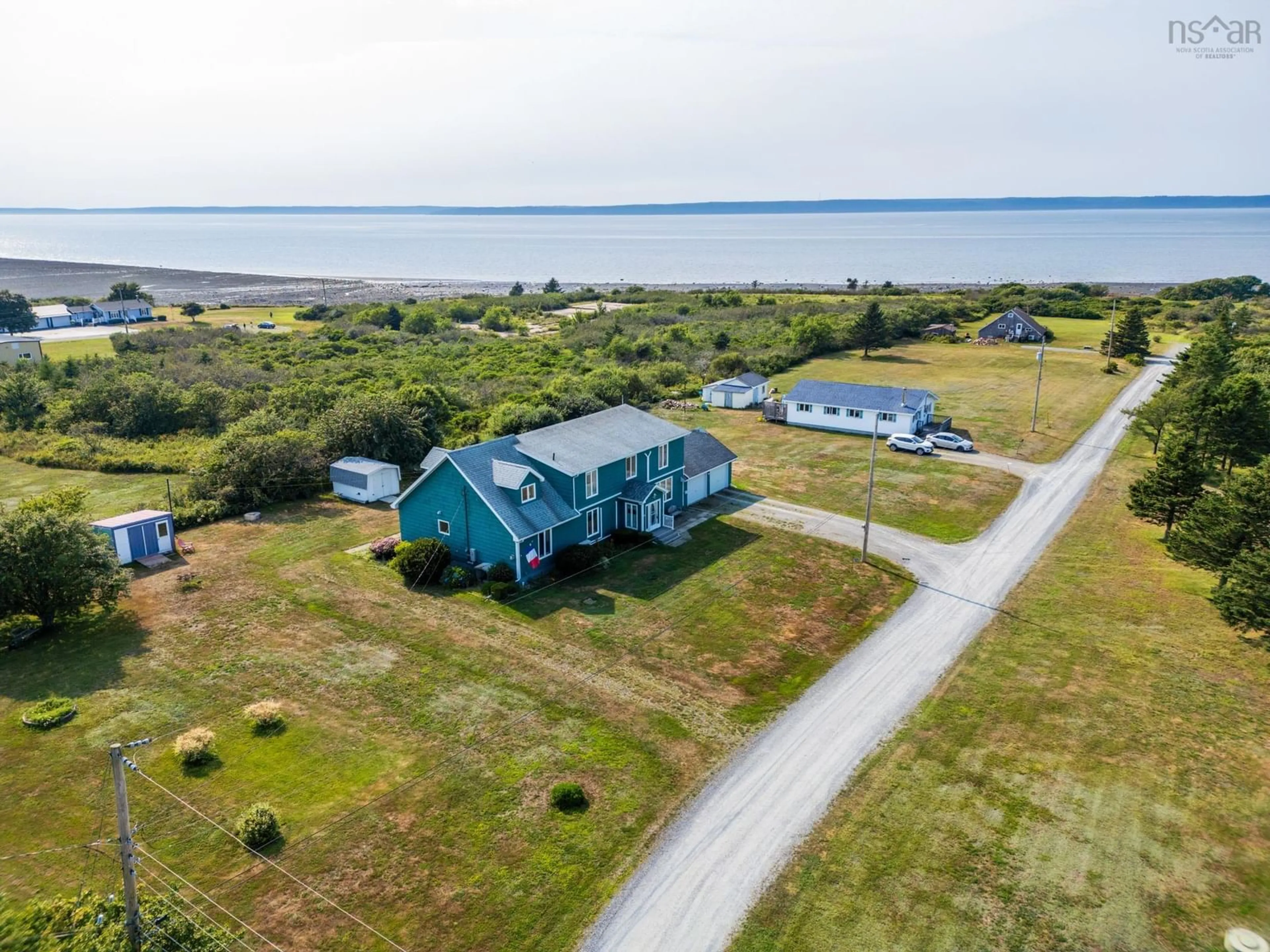 A pic from outside/outdoor area/front of a property/back of a property/a pic from drone, water/lake/river/ocean view for 92 Dixon Rd, Grosses Coques Nova Scotia B0W 1M0