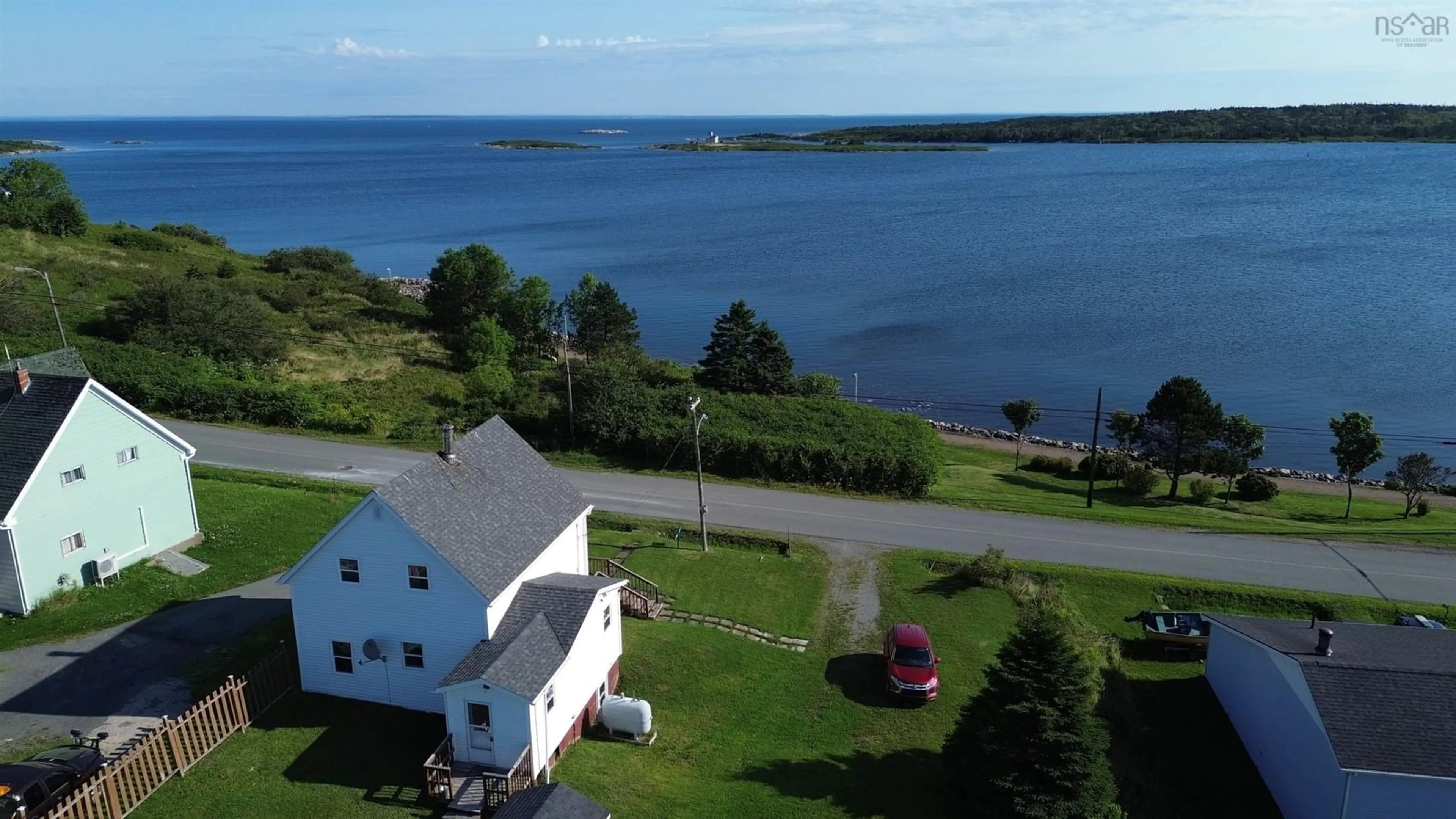 A pic from outside/outdoor area/front of a property/back of a property/a pic from drone, water/lake/river/ocean view for 1440 Union Street, Canso Nova Scotia B0H 1H0