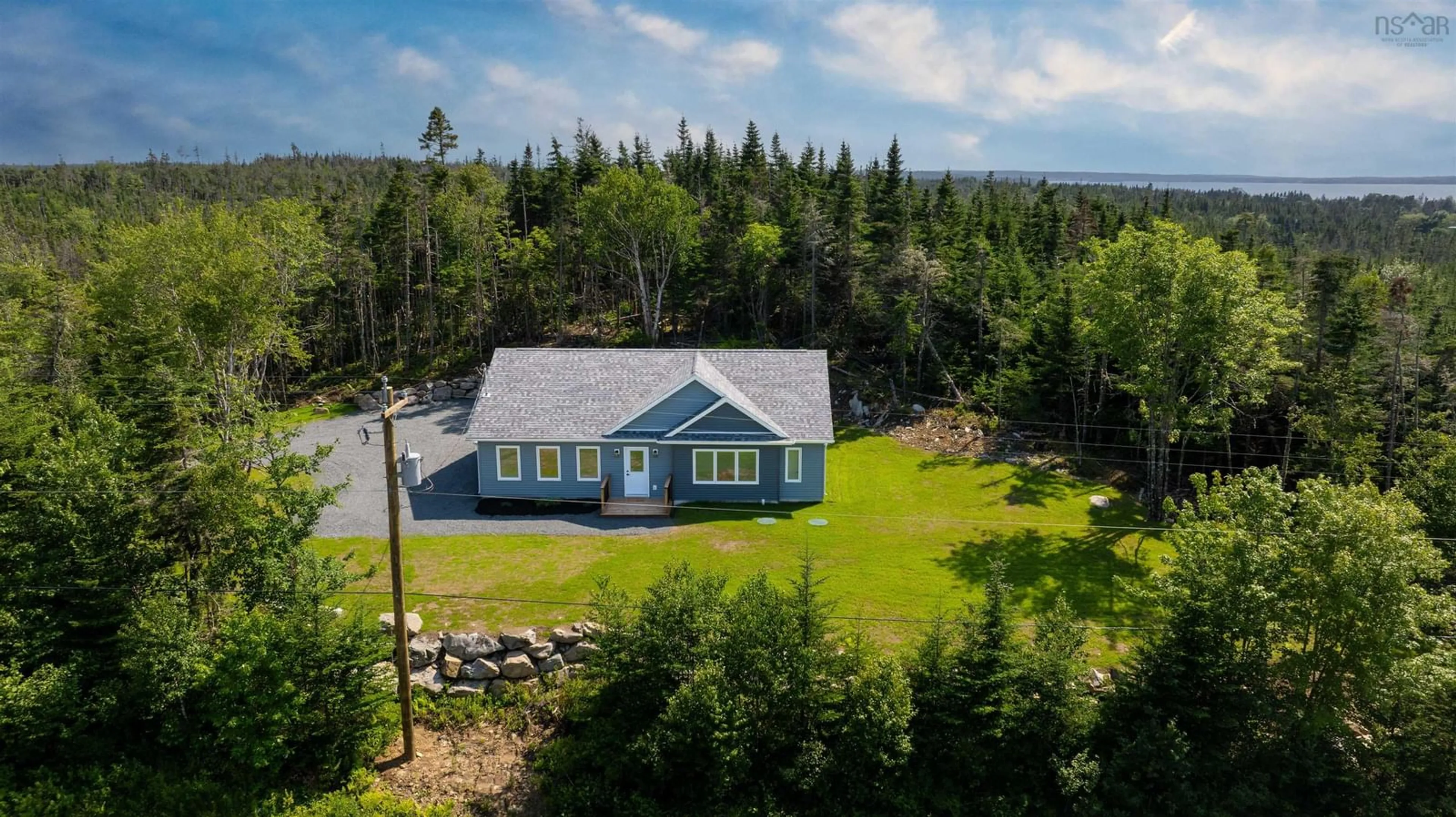 A pic from outside/outdoor area/front of a property/back of a property/a pic from drone, water/lake/river/ocean view for 10546 Highway 7 Hwy, Oyster Pond Nova Scotia B0J 2L0