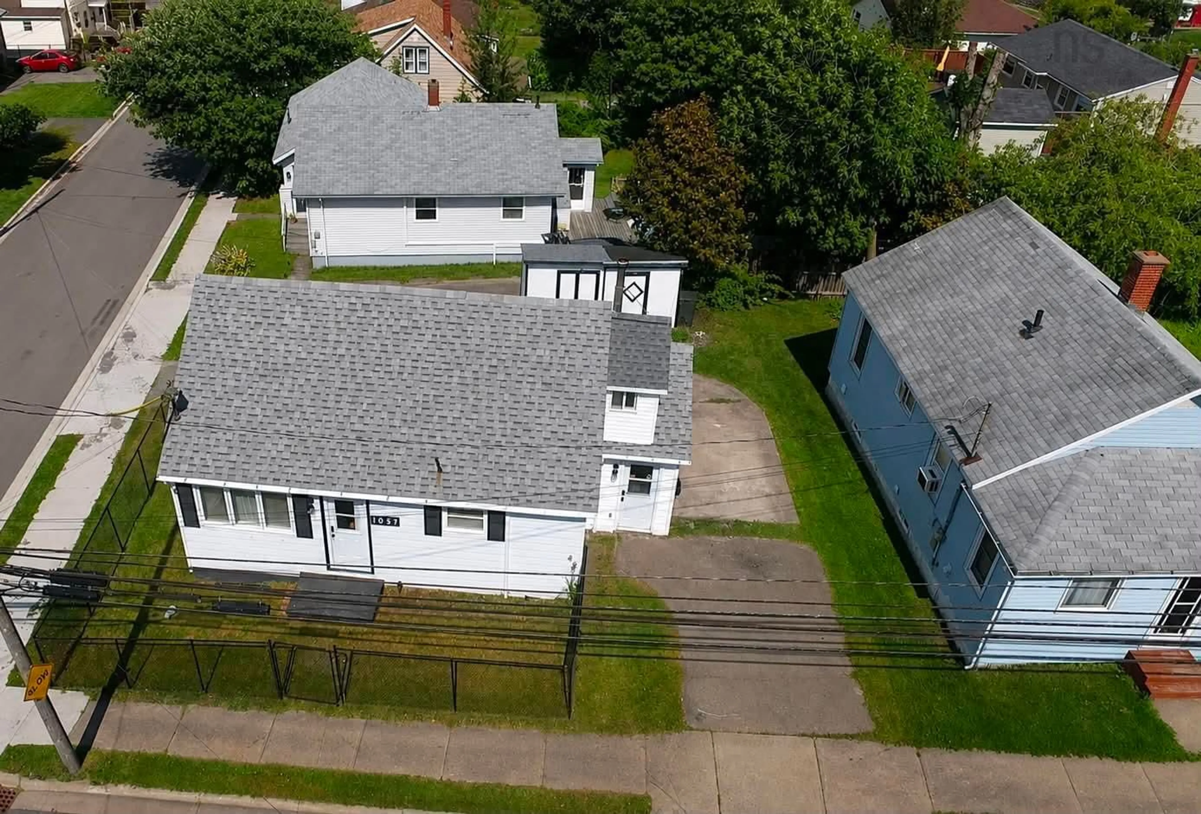 A pic from outside/outdoor area/front of a property/back of a property/a pic from drone, unknown for 1057 George St, Sydney Nova Scotia B1P 1M9