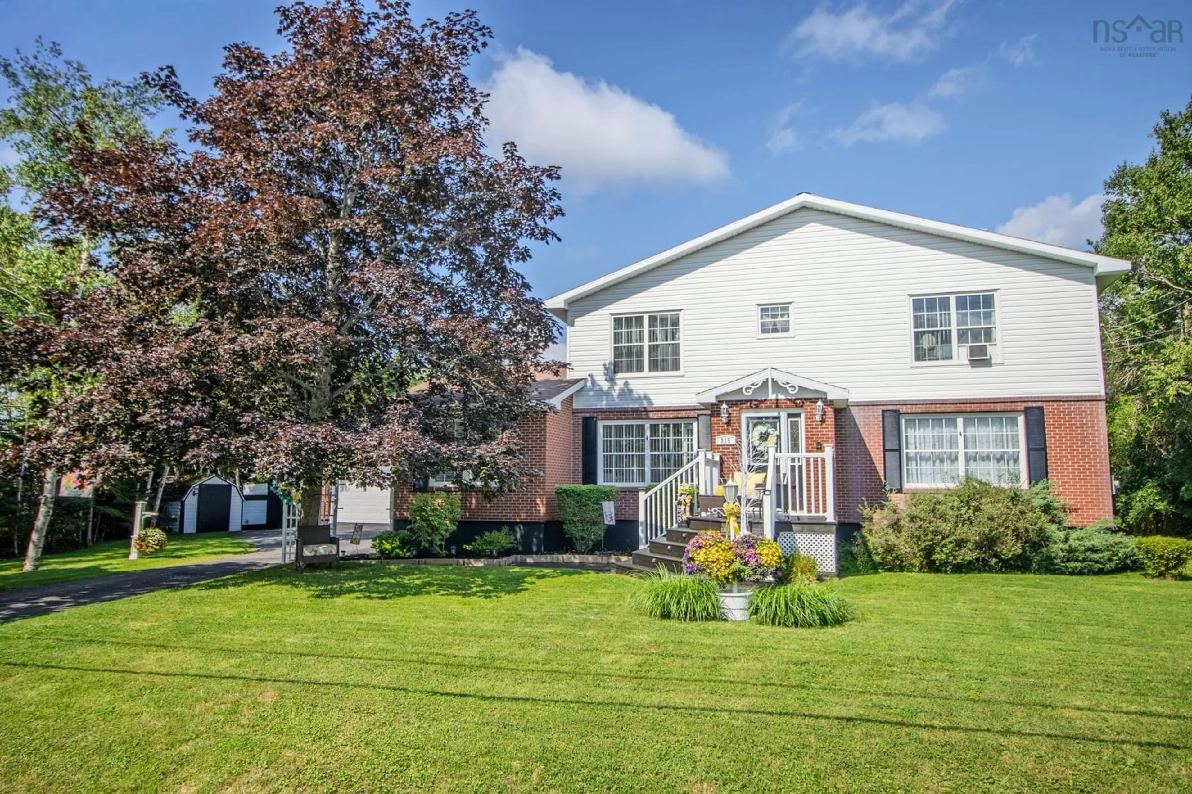 Home with vinyl exterior material, street for 215 Evergreen Dr, Sydney Nova Scotia B1M 1A6