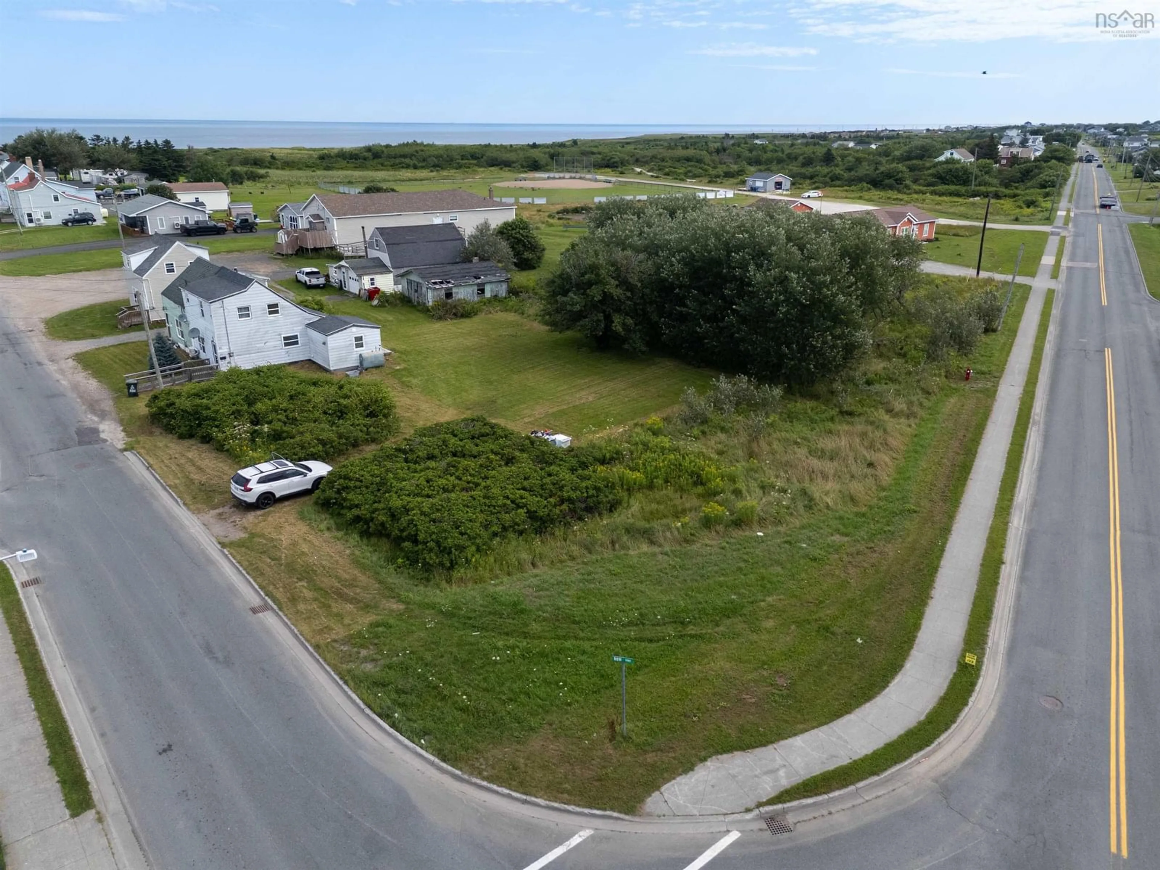 A pic from outside/outdoor area/front of a property/back of a property/a pic from drone, water/lake/river/ocean view for 10 Row Street, Glace Bay Nova Scotia B1A 4T7