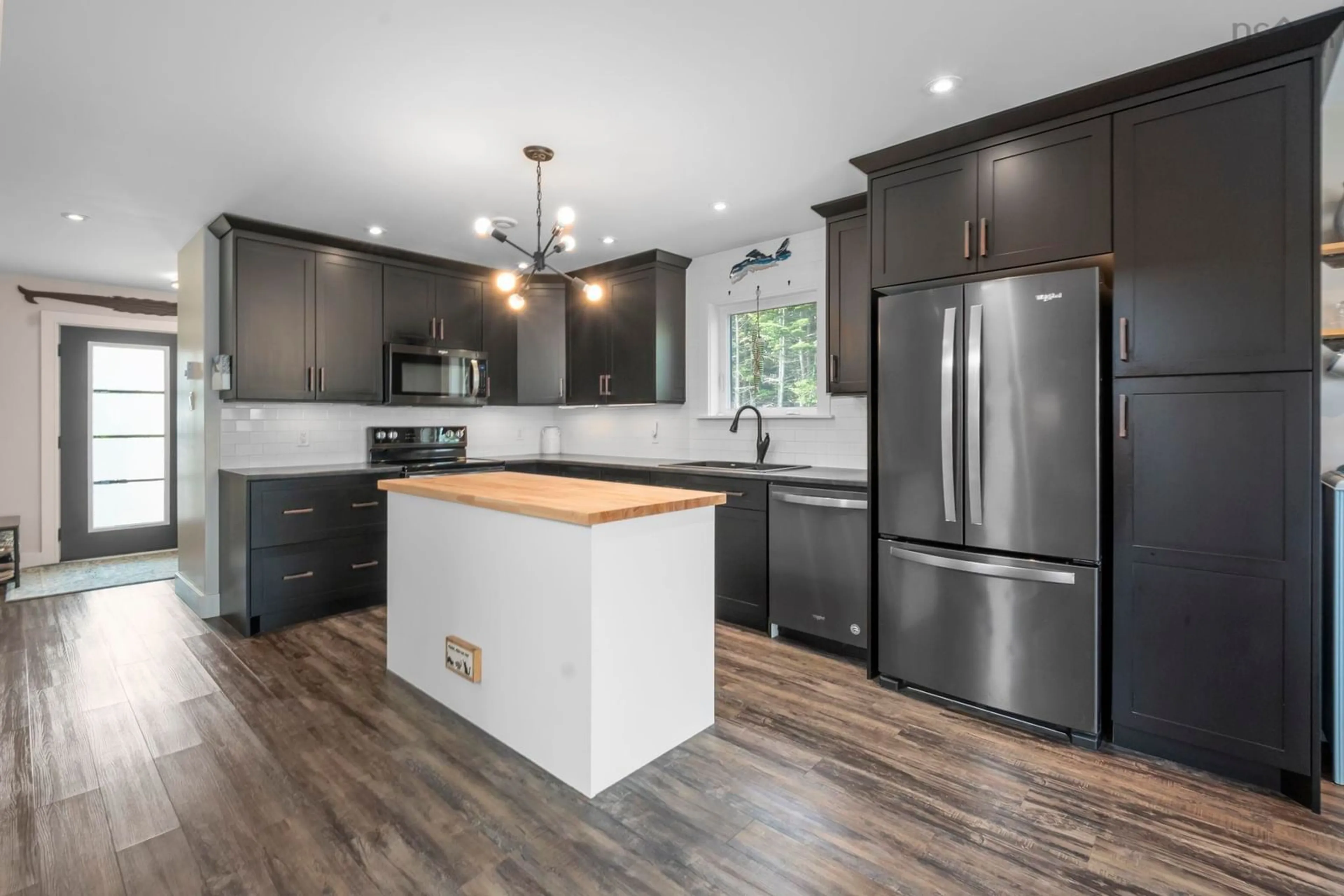 Open concept kitchen, wood/laminate floor for 1303 Ketch Harbour Rd, Ketch Harbour Nova Scotia B3V 0B5