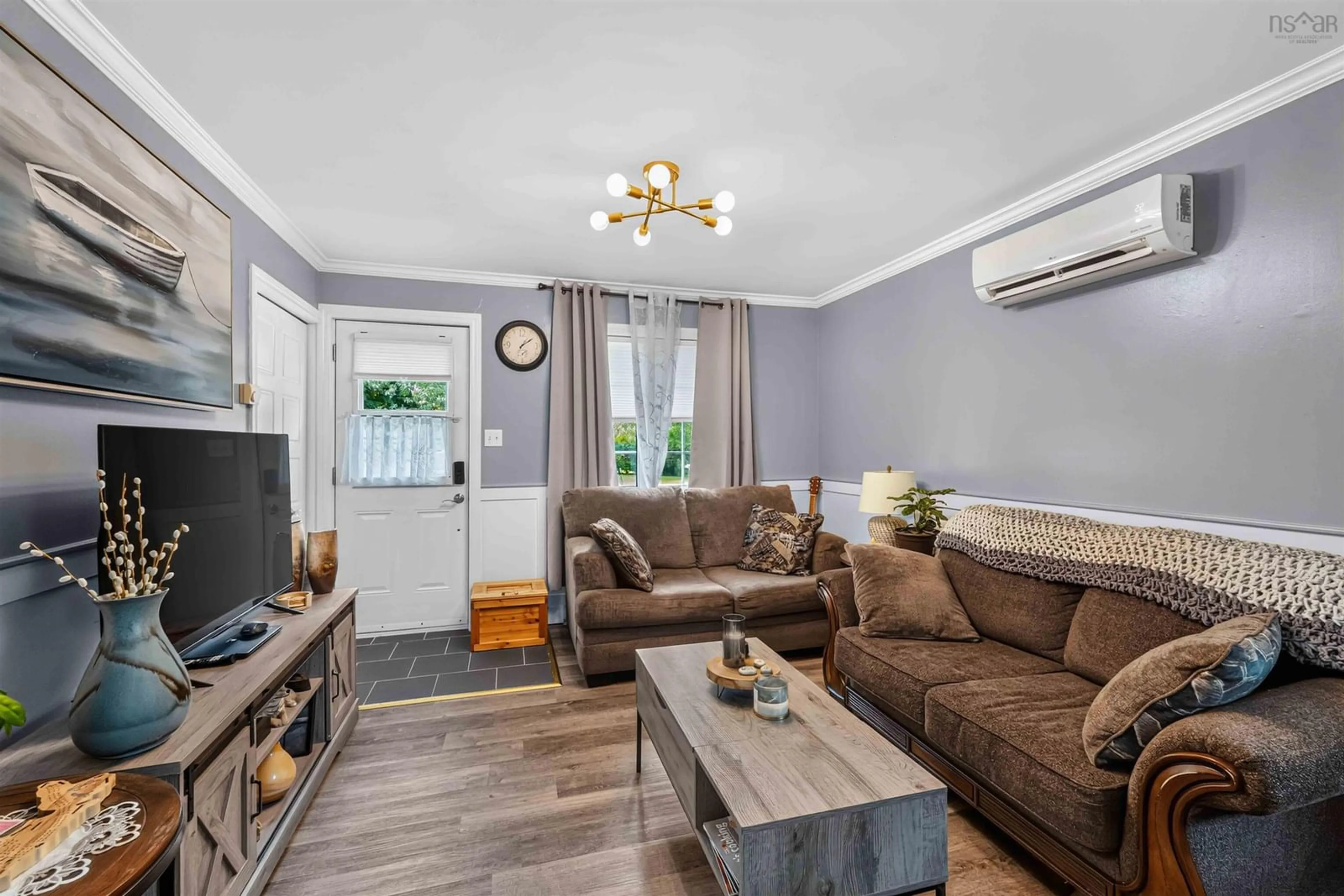 Living room with furniture, wood/laminate floor for 130 Sunset Cres, Middleton Nova Scotia B0S 1P0