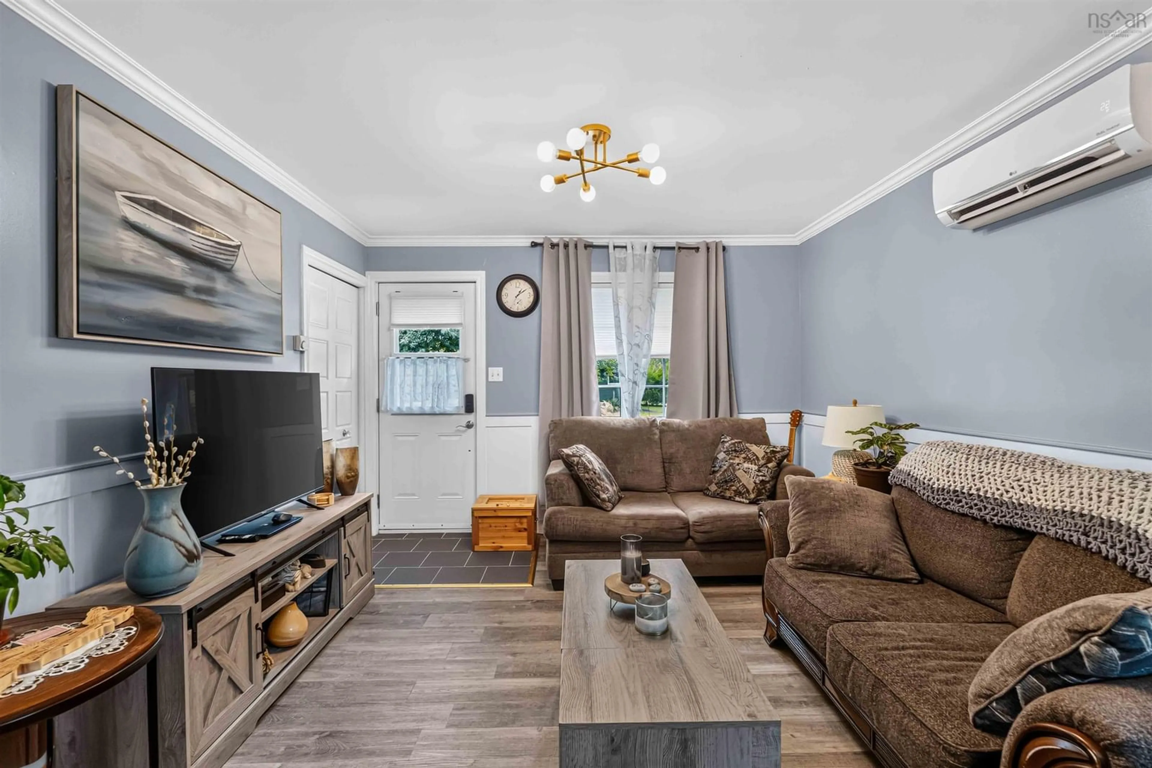Living room with furniture, wood/laminate floor for 130 Sunset Cres, Middleton Nova Scotia B0S 1P0