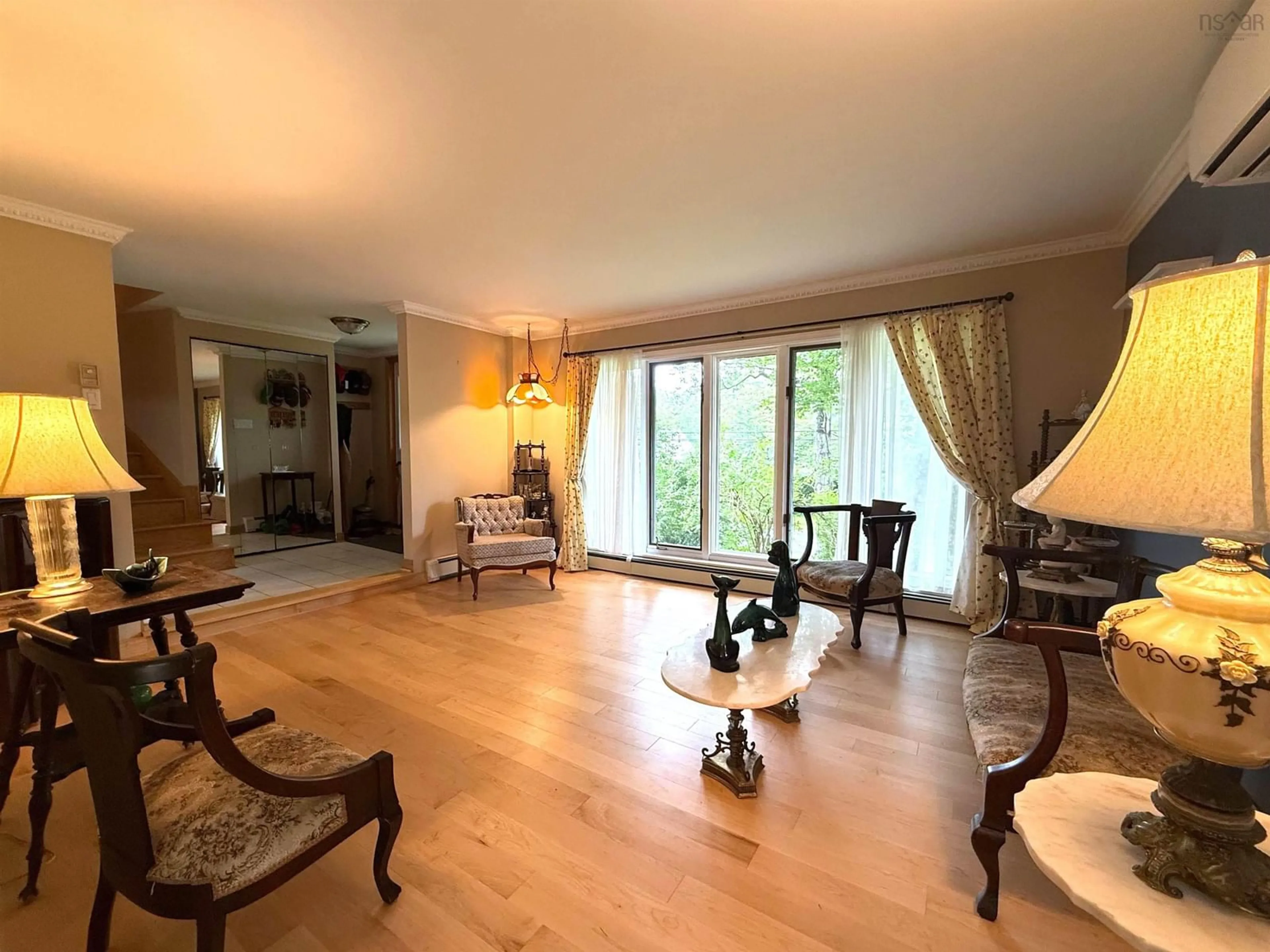 Living room with furniture, wood/laminate floor for 204 High St, Bedford Nova Scotia B4A 1N7