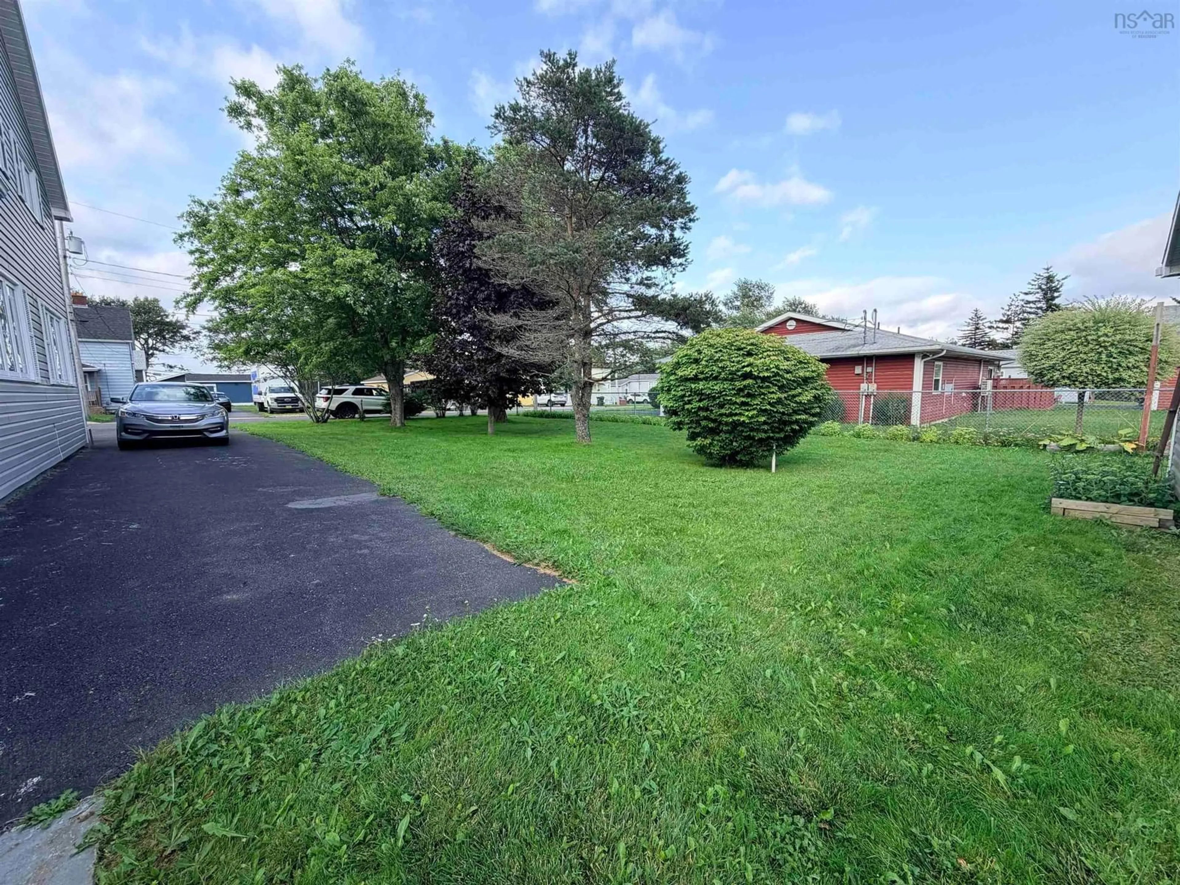 A pic from outside/outdoor area/front of a property/back of a property/a pic from drone, street for 3436 Wood Ave, New Waterford Nova Scotia B1H 1V3