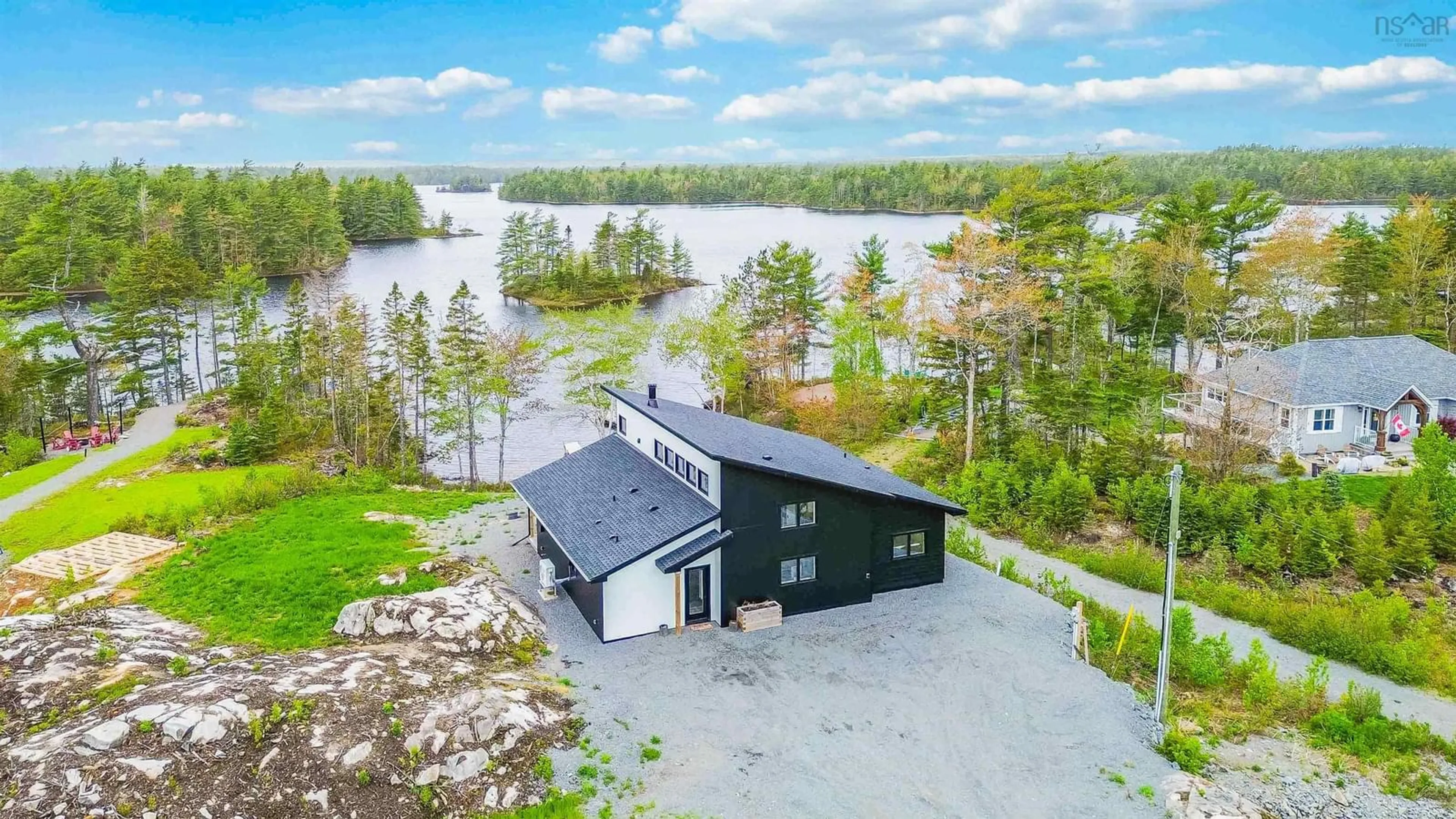 A pic from outside/outdoor area/front of a property/back of a property/a pic from drone, water/lake/river/ocean view for 242 Heritage Way, East Uniacke Nova Scotia B0N 1Z0