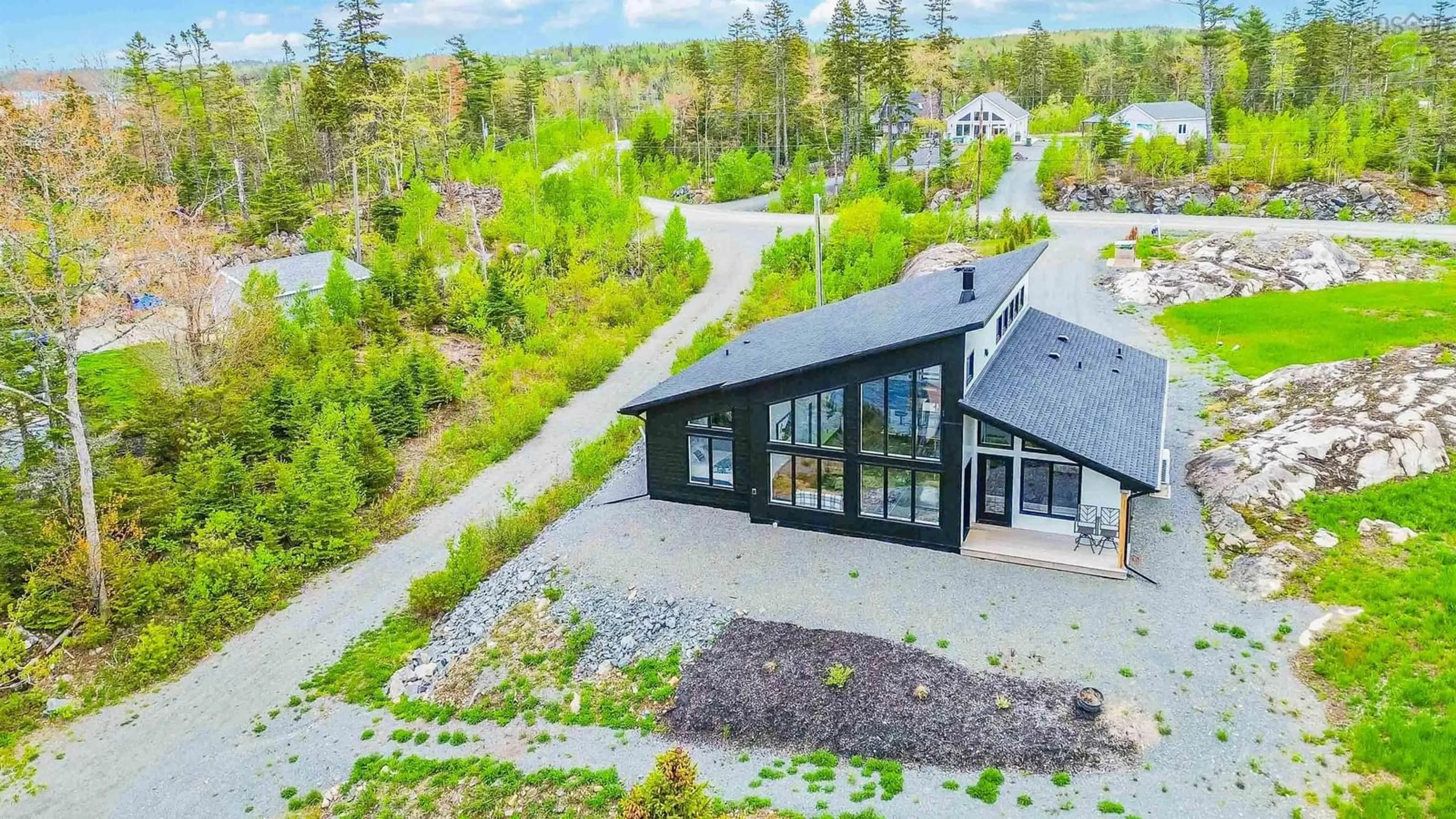 A pic from outside/outdoor area/front of a property/back of a property/a pic from drone, unknown for 242 Heritage Way, East Uniacke Nova Scotia B0N 1Z0