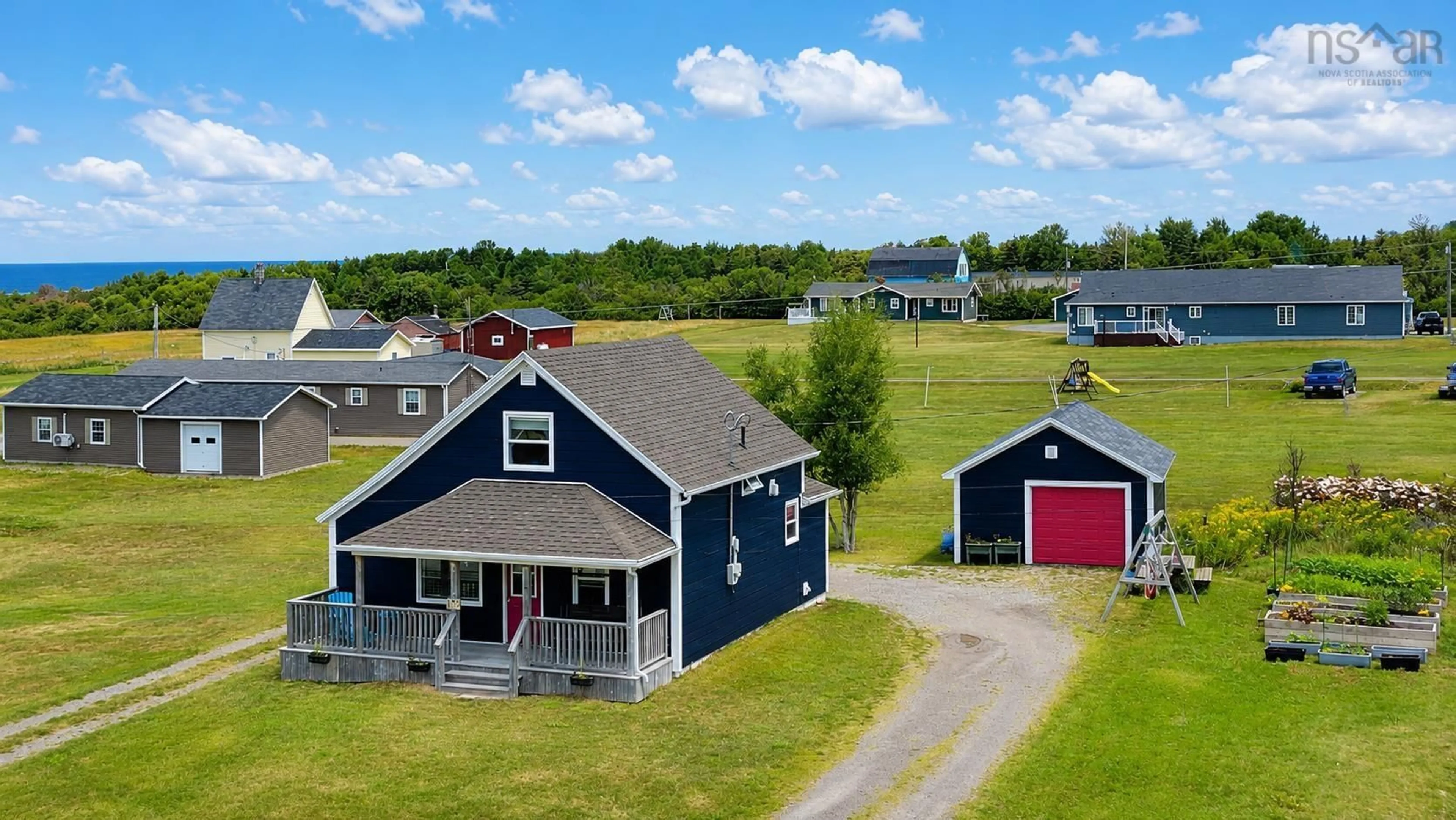 A pic from outside/outdoor area/front of a property/back of a property/a pic from drone, water/lake/river/ocean view for 35 Chemin Broussard, Petit Étang Nova Scotia B0E 2M0