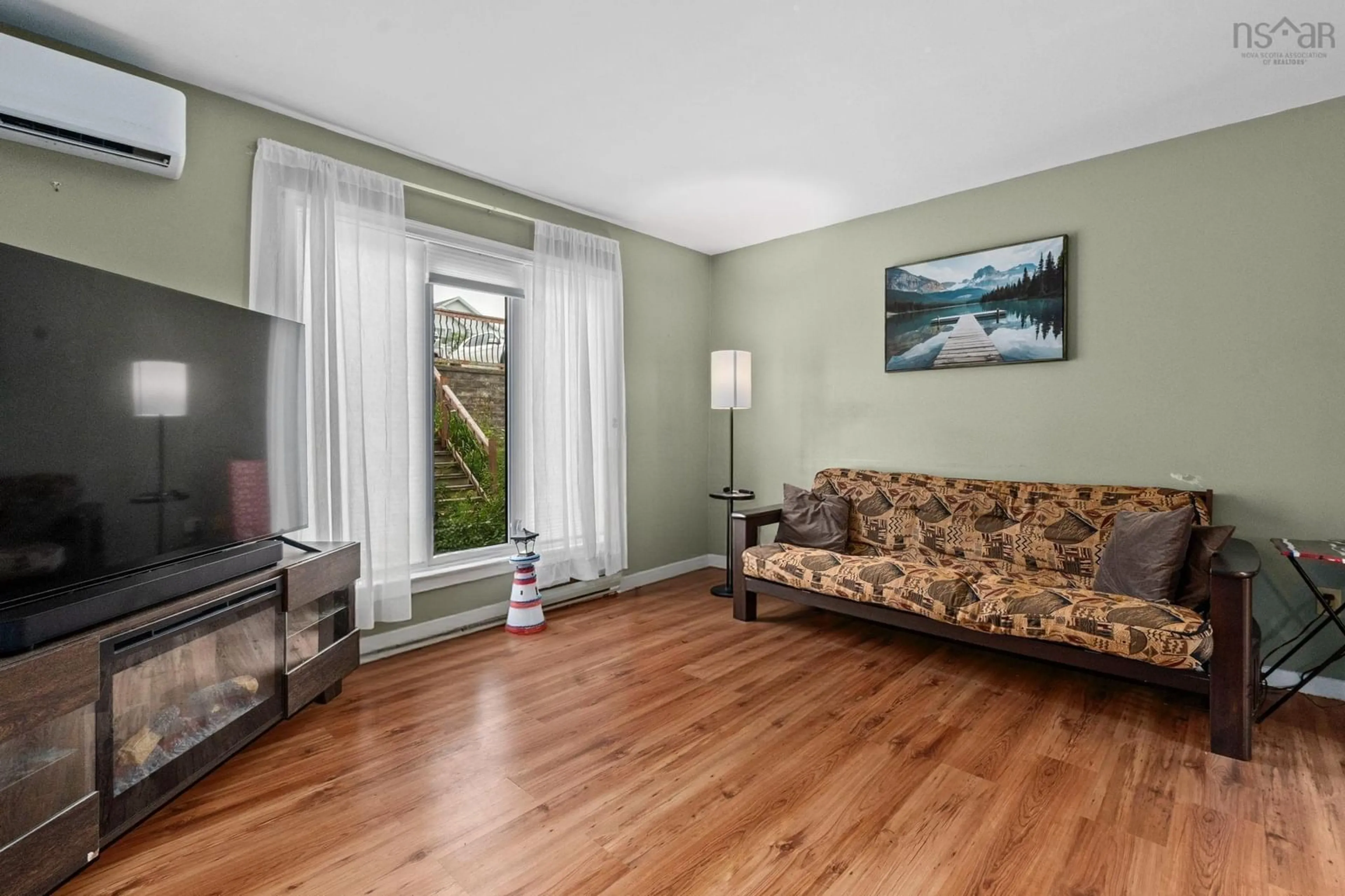 Living room with furniture, wood/laminate floor for 963 Old Sackville Rd, Middle Sackville Nova Scotia B4E 1R4